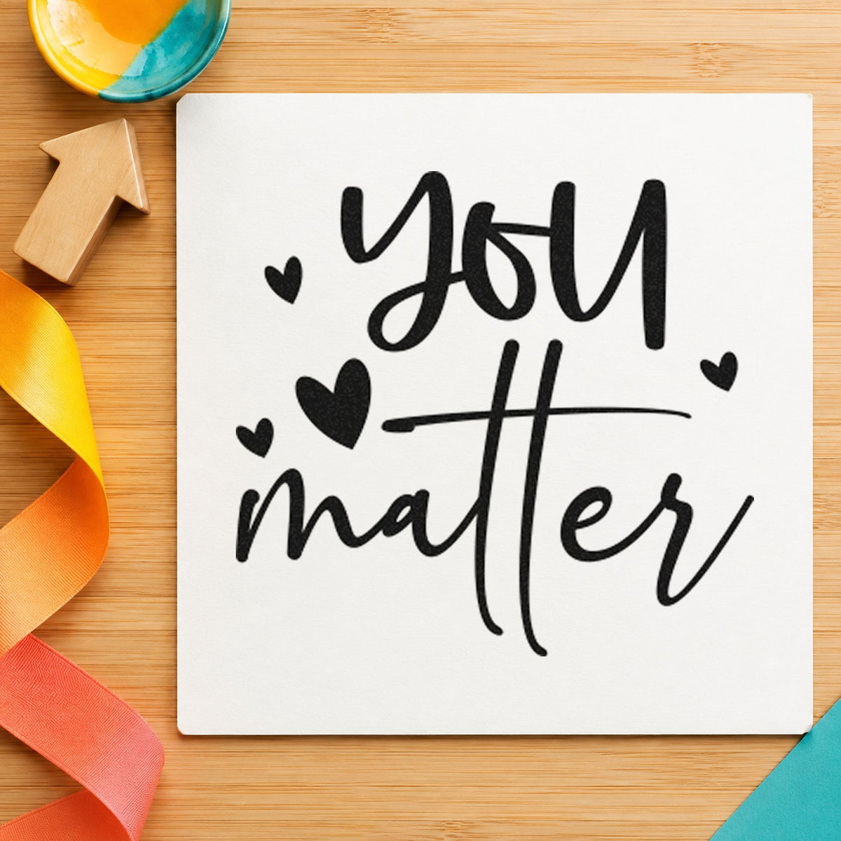 You Matter Scattered Hearts craft stamp imprint in black ink on a handmade project, one idea being comfort kit gift tags.