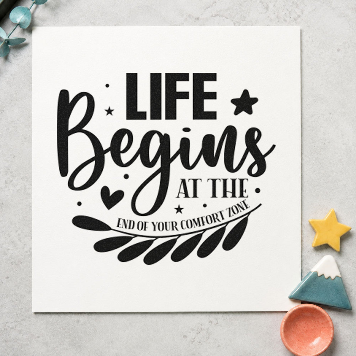 Life Begins Comfort Zone Leaves craft stamp imprint in black ink on a handmade project, one idea being note pad gift tags.