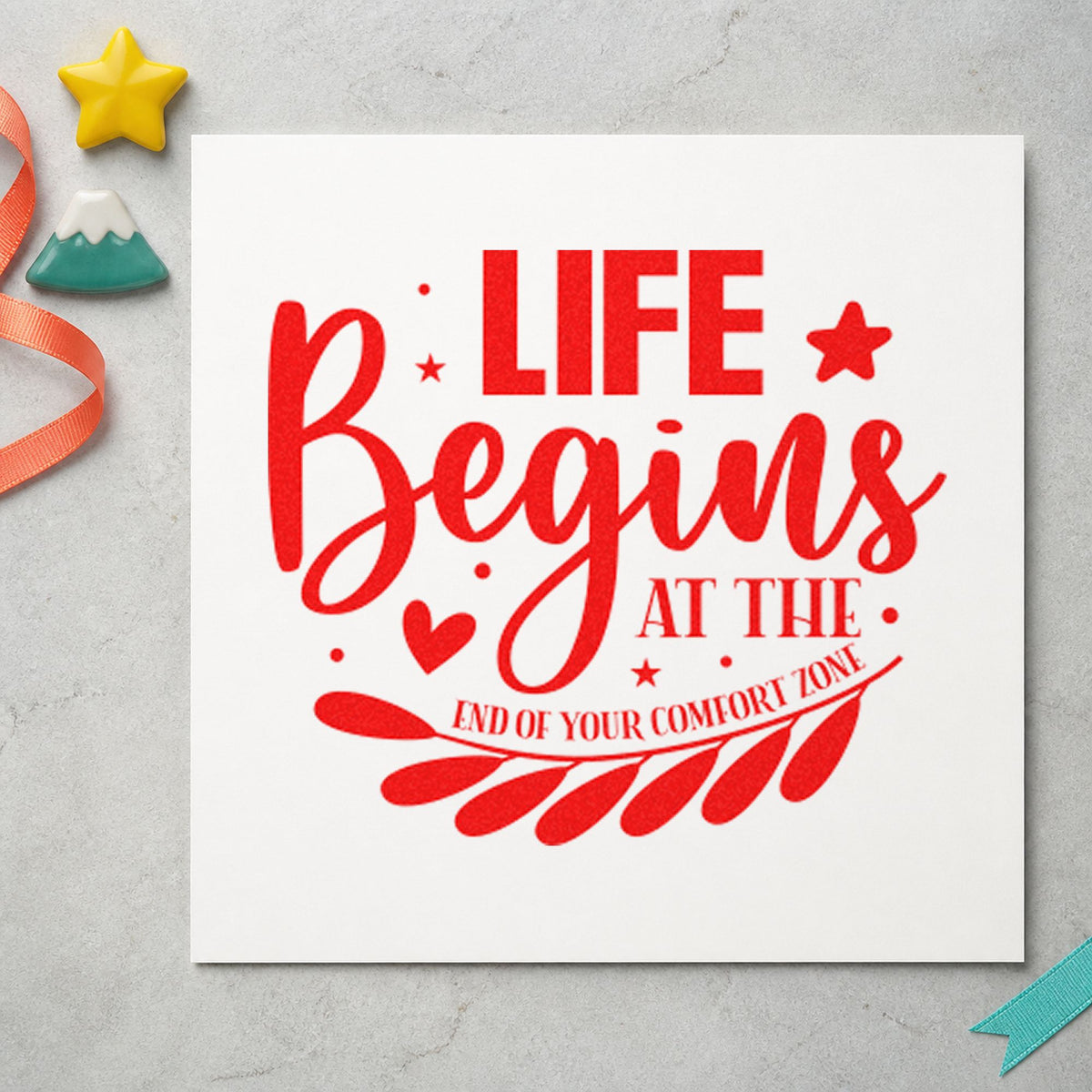 Life Begins Comfort Zone Leaves craft stamp imprint in red ink on a handmade project, one idea being bit idea cards.