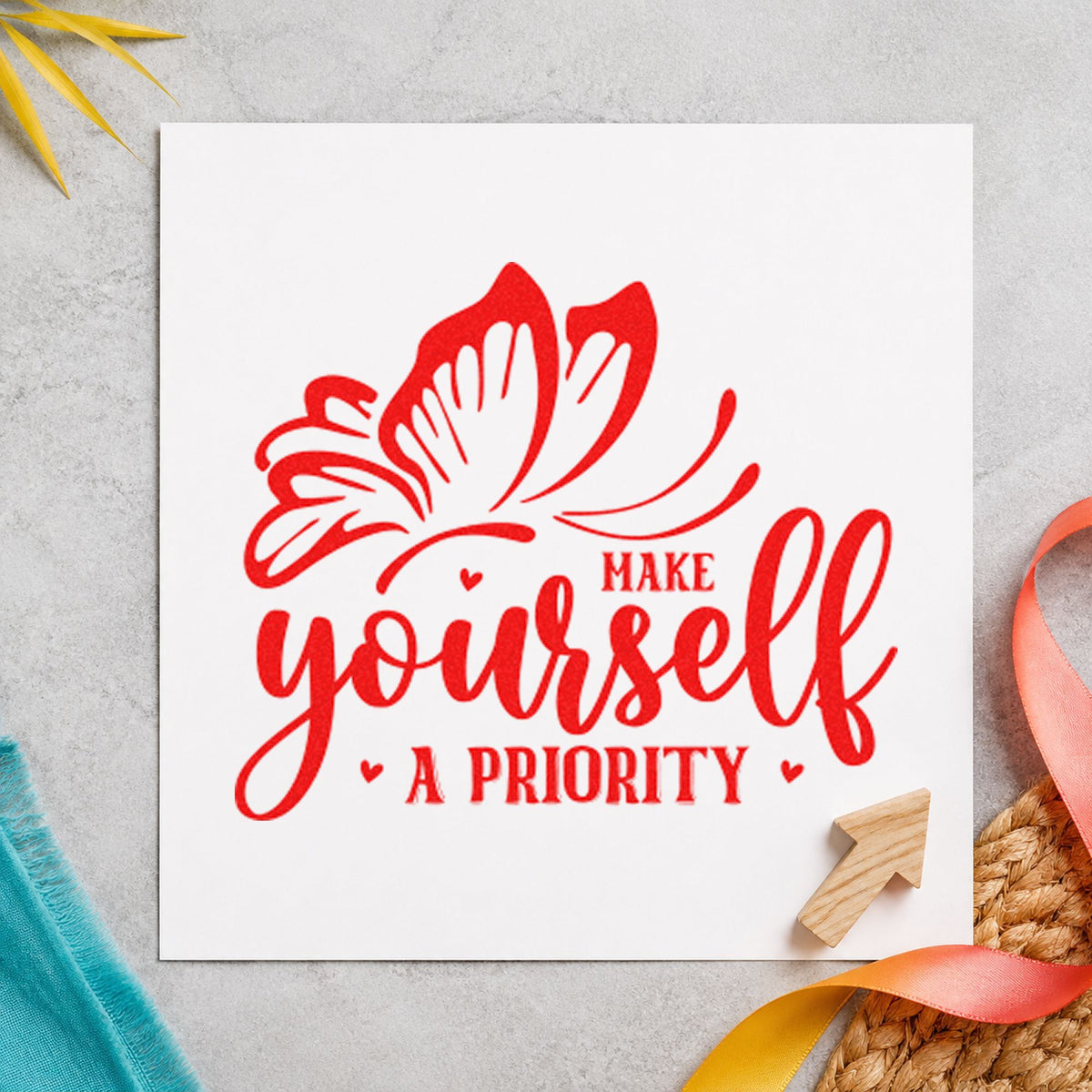 Make Yourself A Priority Butterfly rubber stamp shown in red ink, stamped for projects such as bin spare labels.