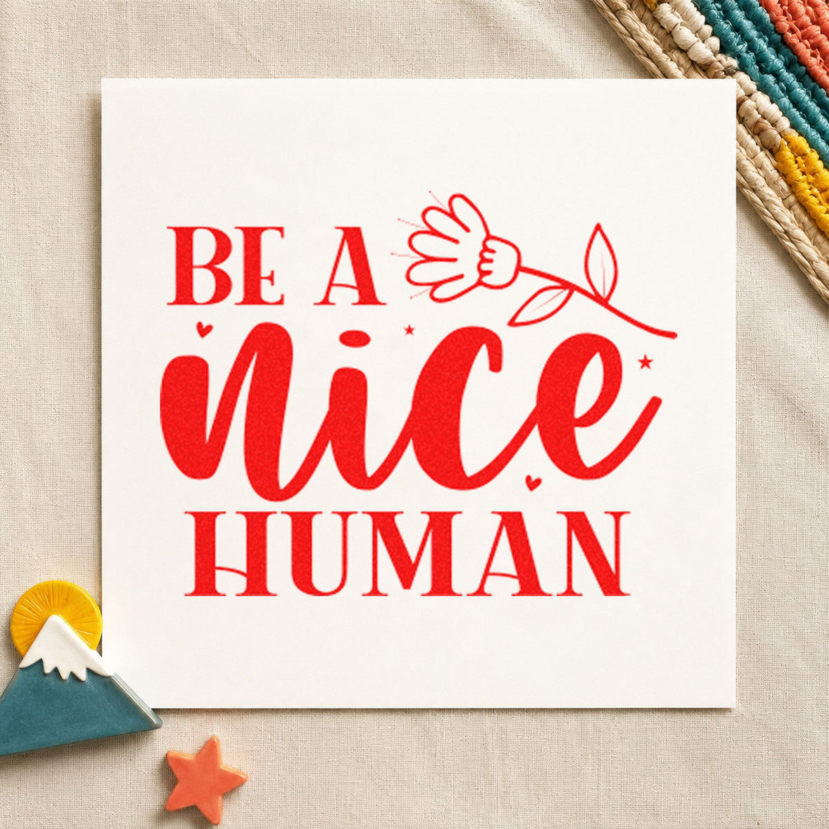 Be A Nice Human Flower rubber stamp shown in red ink, stamped for projects such as rack tool labels.