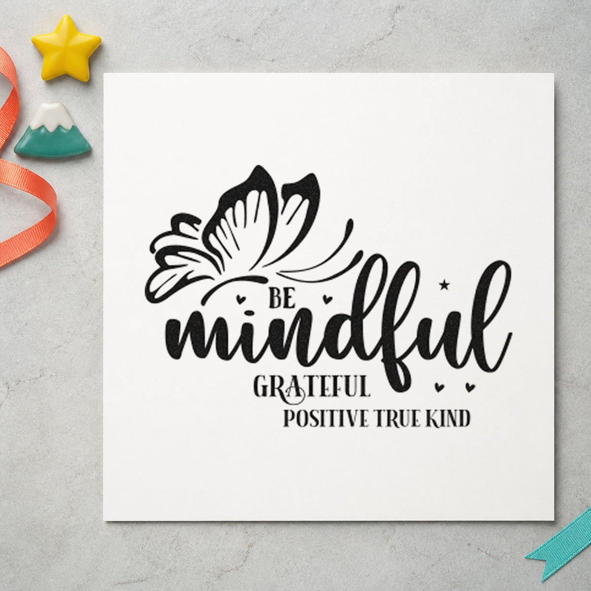 Be Mindful Butterfly Gratitude craft stamp imprint in black ink on a handmade project, one idea being sensory kit gift tags.