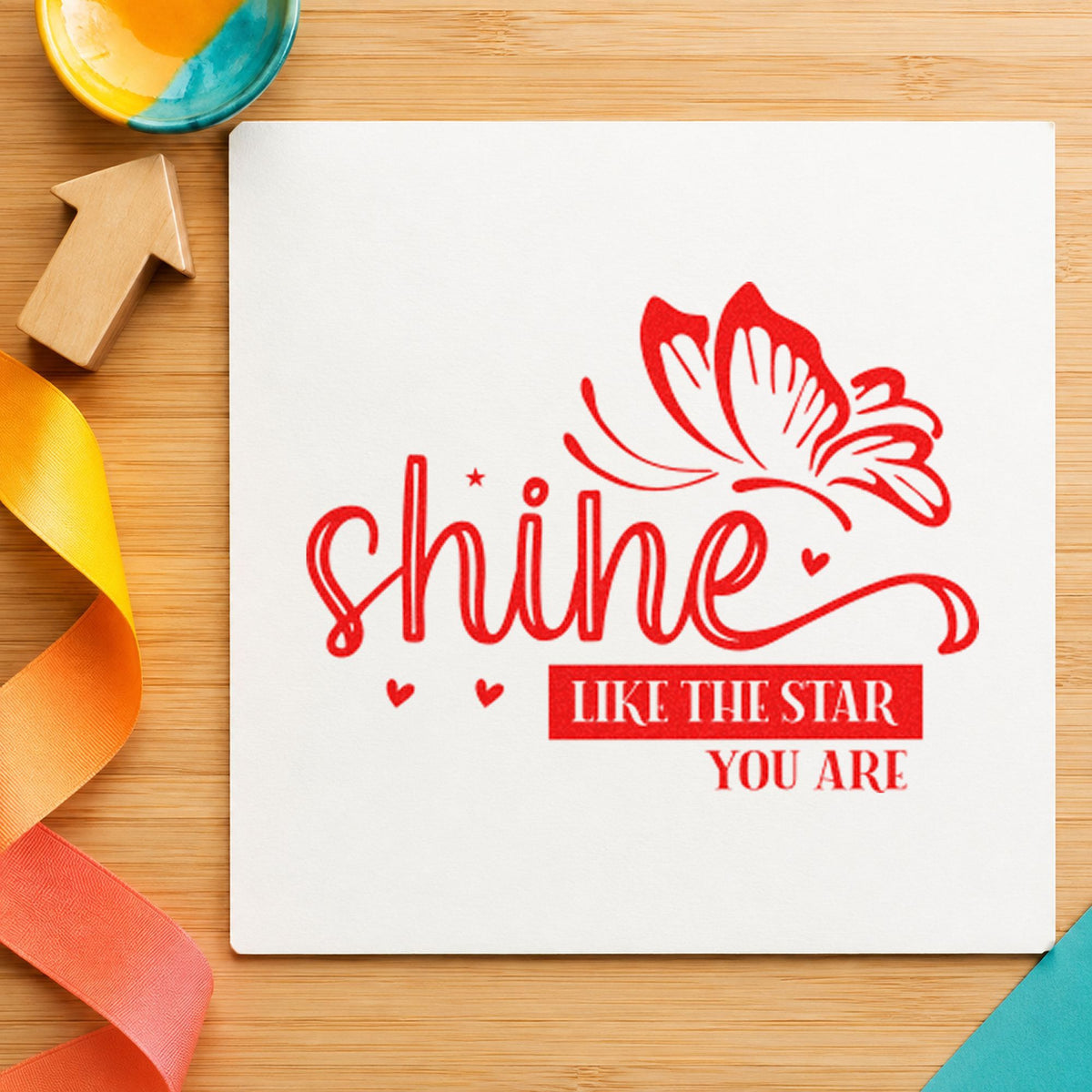 Shine Like Star Butterfly craft stamp imprint in red ink on a handmade project, one idea being sing goal cards.