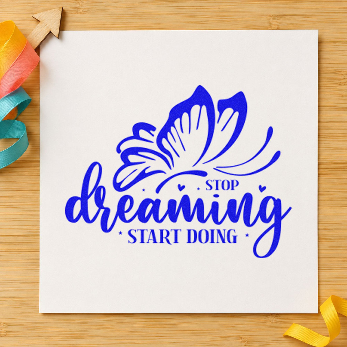 Stop Dreaming Start Doing Butterfly craft stamp in blue ink on cardstock, an easy option for kitchen apron printing.