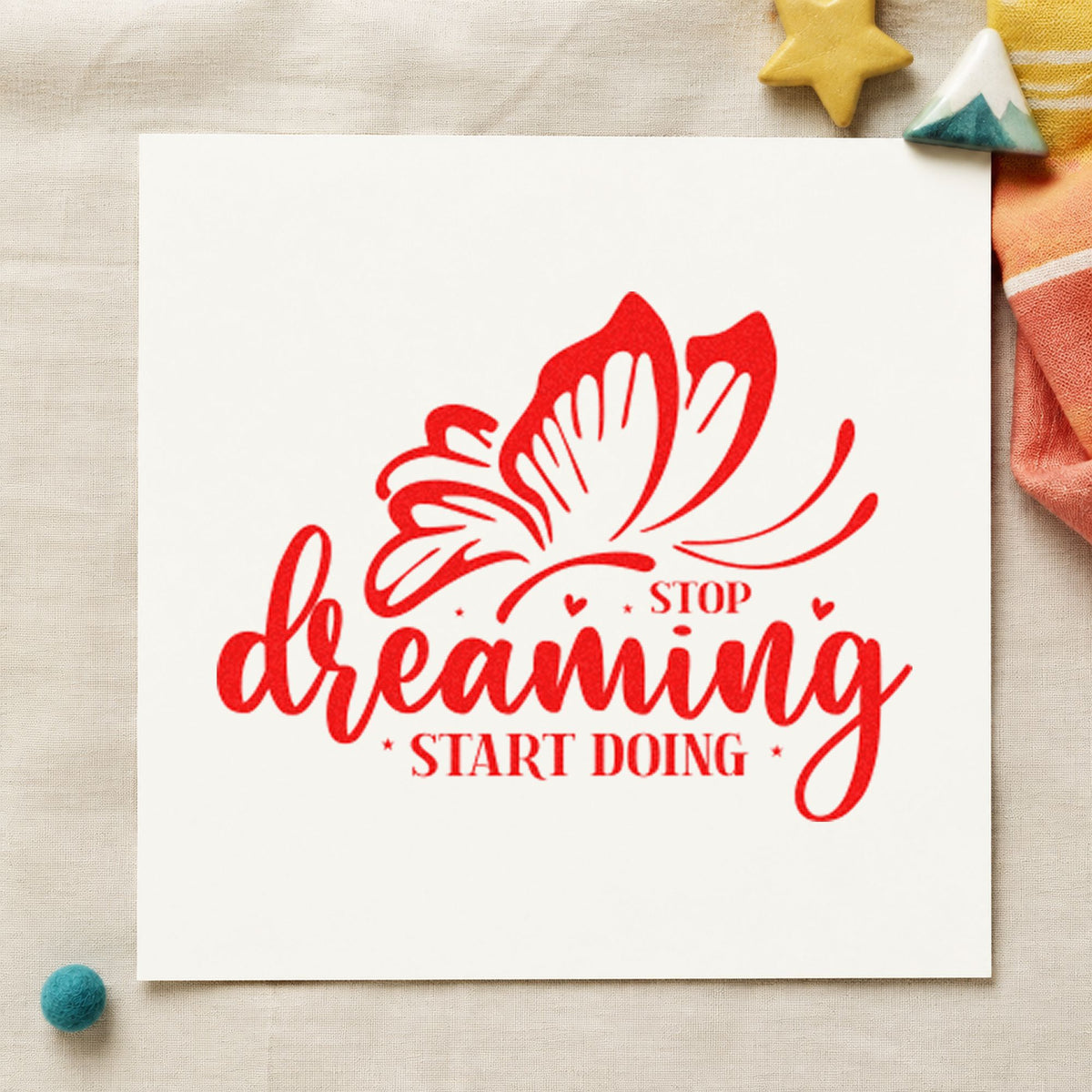 Stop Dreaming Start Doing Butterfly craft stamp imprint in red ink on a handmade project, one idea being tester feedback cards.