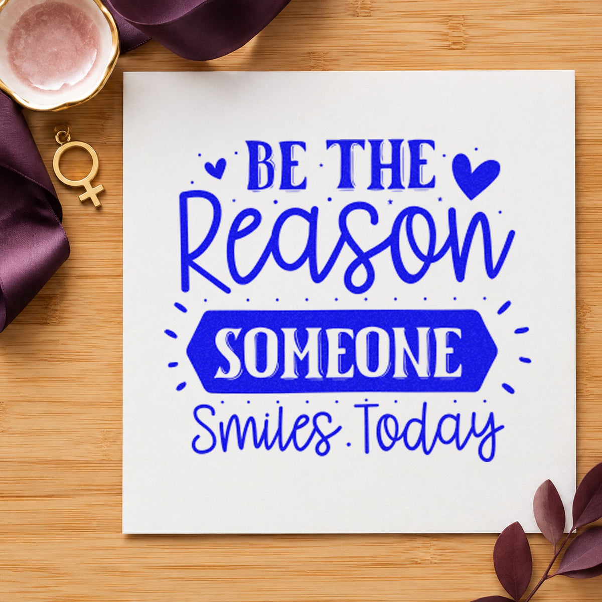 Be Reason Someone Smiles Today craft stamp in blue ink on cardstock, an easy option for apron panel printing.