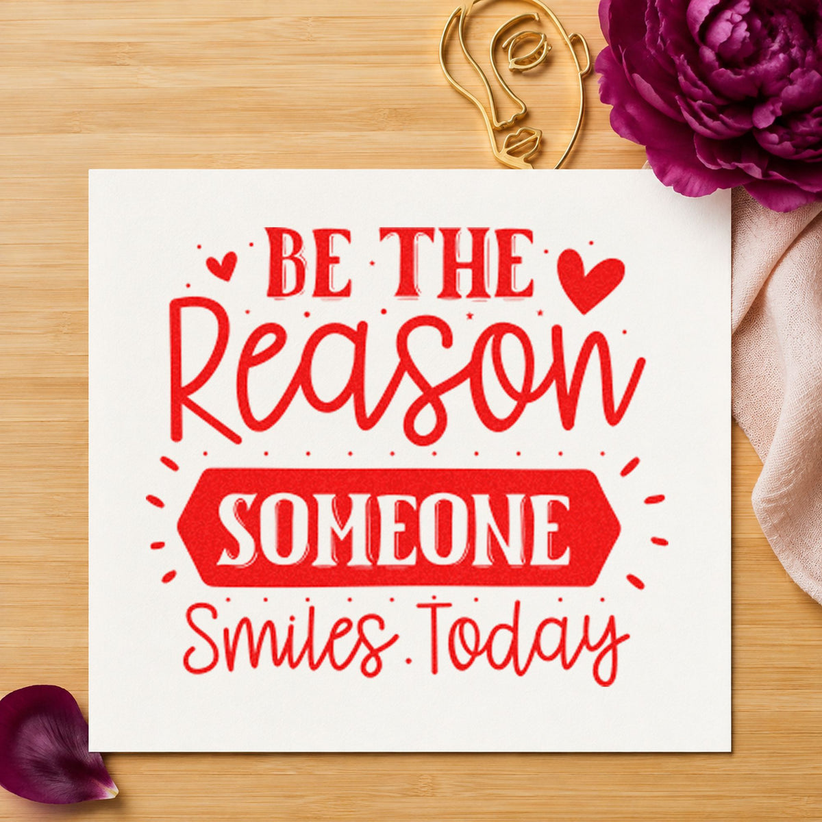 Be Reason Someone Smiles Today craft stamp imprint in red ink on a handmade project, one idea being get well cards.