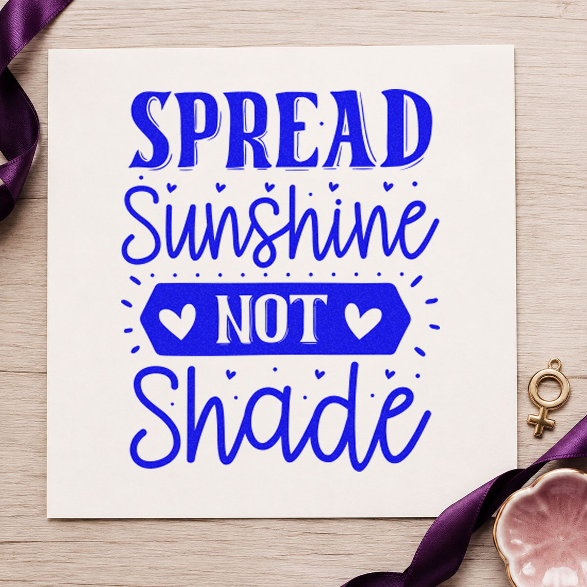 Spread Sunshine Not Shade Hearts craft stamp imprinted in blue ink on paper, a design suited to framed guard shack.