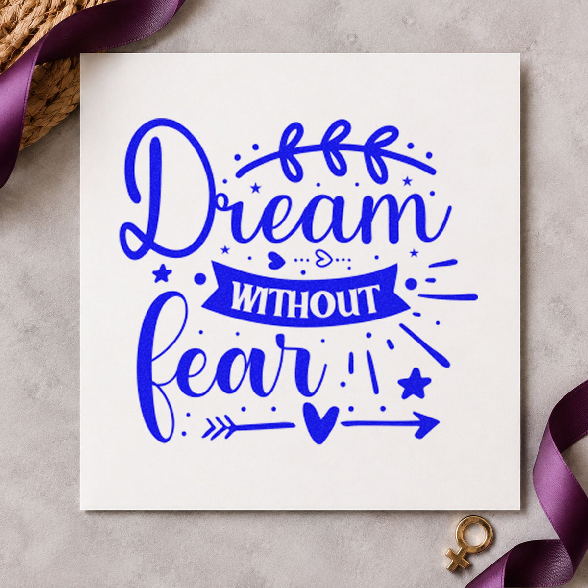 Dream Without Fear Leaf Arrow craft stamp imprinted in blue ink on paper, a design suited to framed study table.