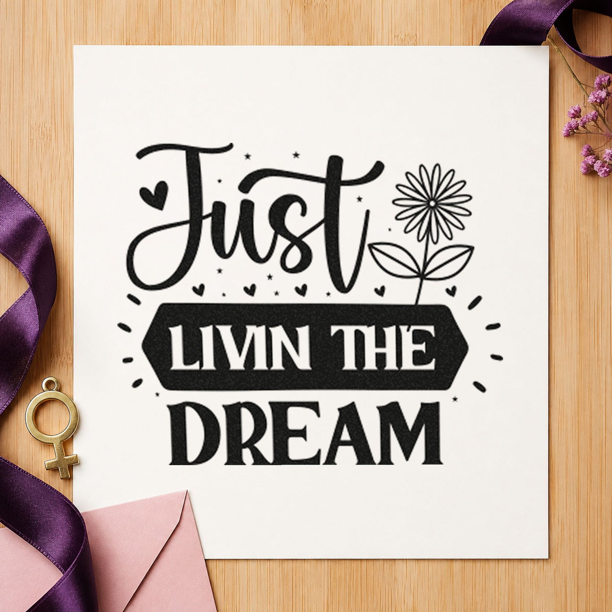 Just Livin Dream Flower craft stamp imprint in black ink on a handmade project, one idea being firewood gift tags.