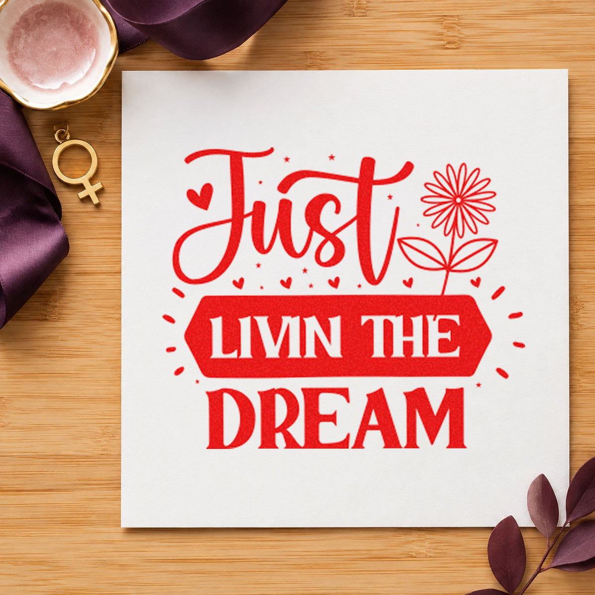 Just Livin Dream Flower craft stamp imprint in red ink on a handmade project, one idea being camp rule cards.