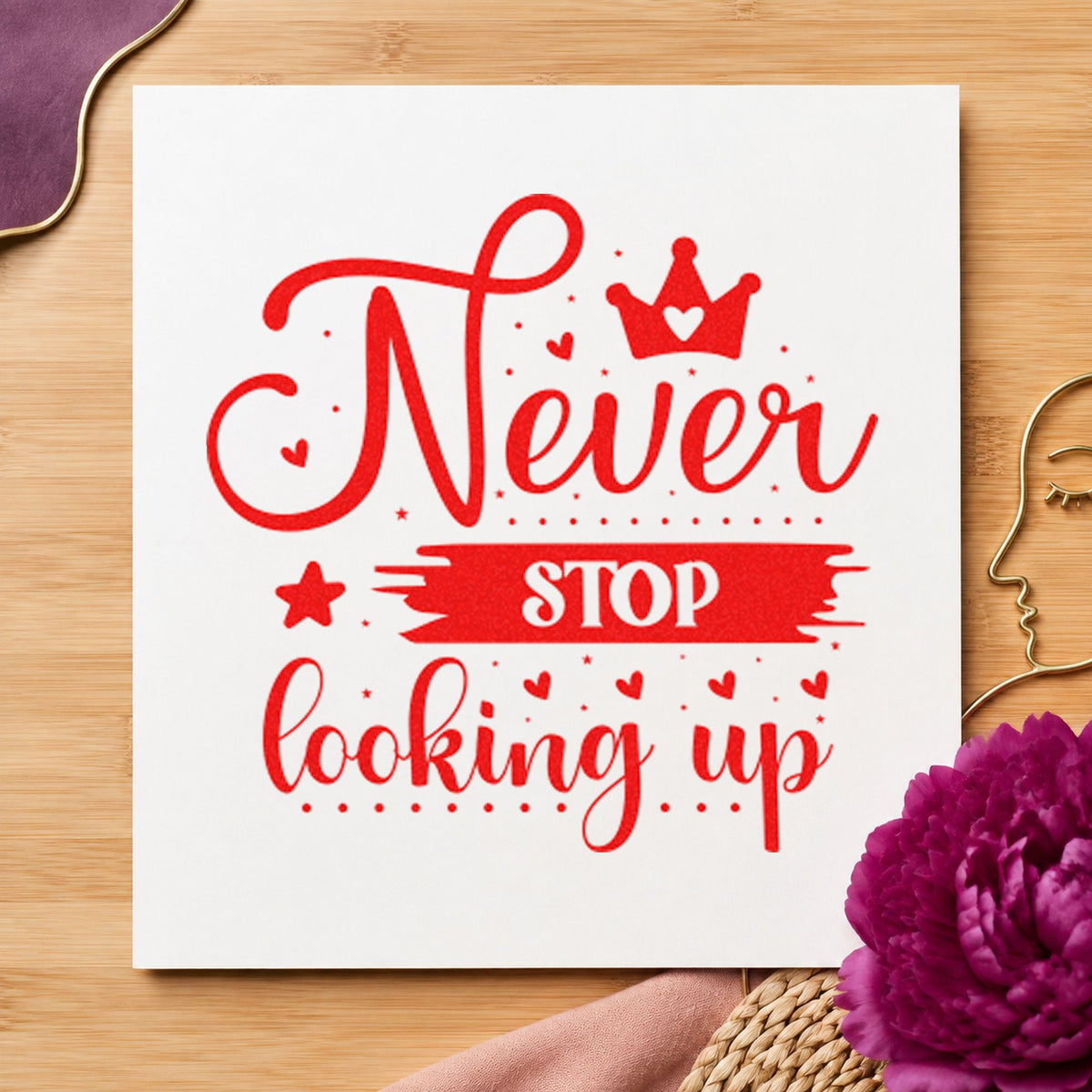 Never Stop Looking Up Crown craft stamp imprint in red ink on a handmade project, one idea being job note cards.
