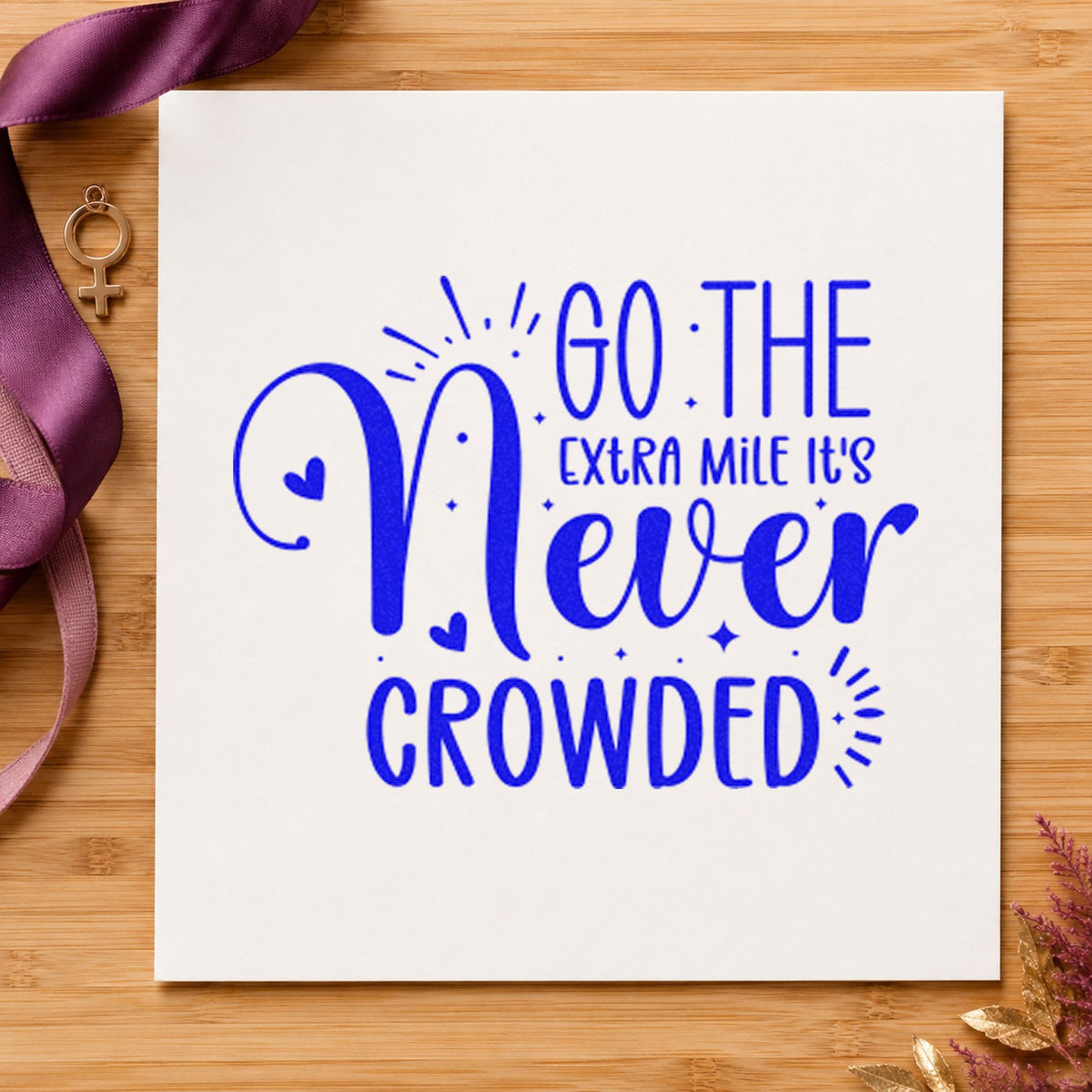 Go Extra Mile Never Crowded craft stamp imprinted in blue ink on paper, a design suited to framed depot bay.