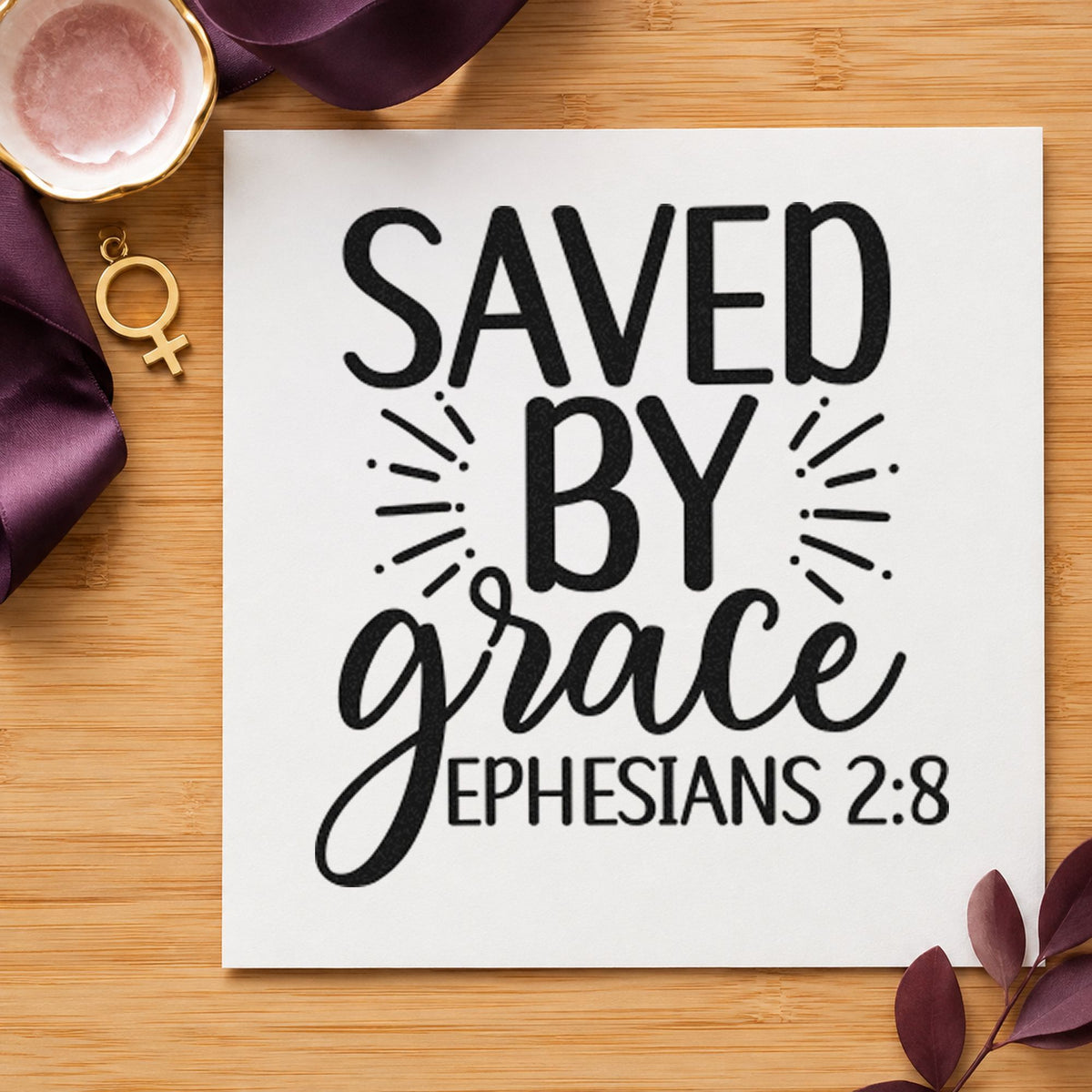 Saved By Grace Ephesians craft stamp imprint in black ink on a handmade project, one idea being welcome bag gift tags.