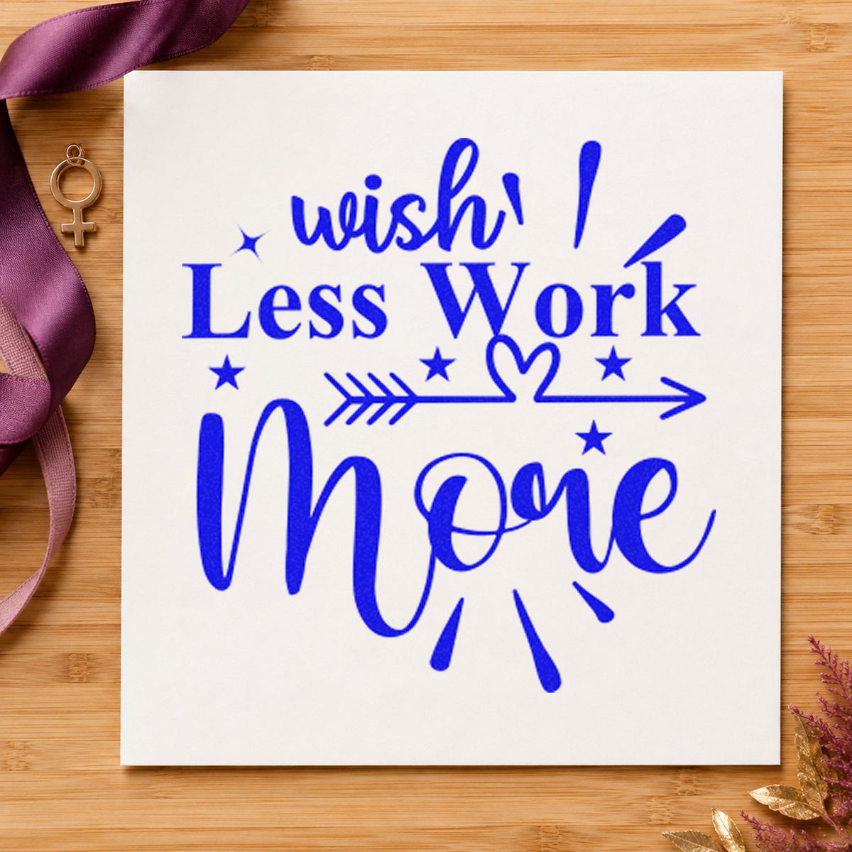 Wish Less Work More Arrow craft stamp in blue ink on cardstock, an easy option for push bag printing.