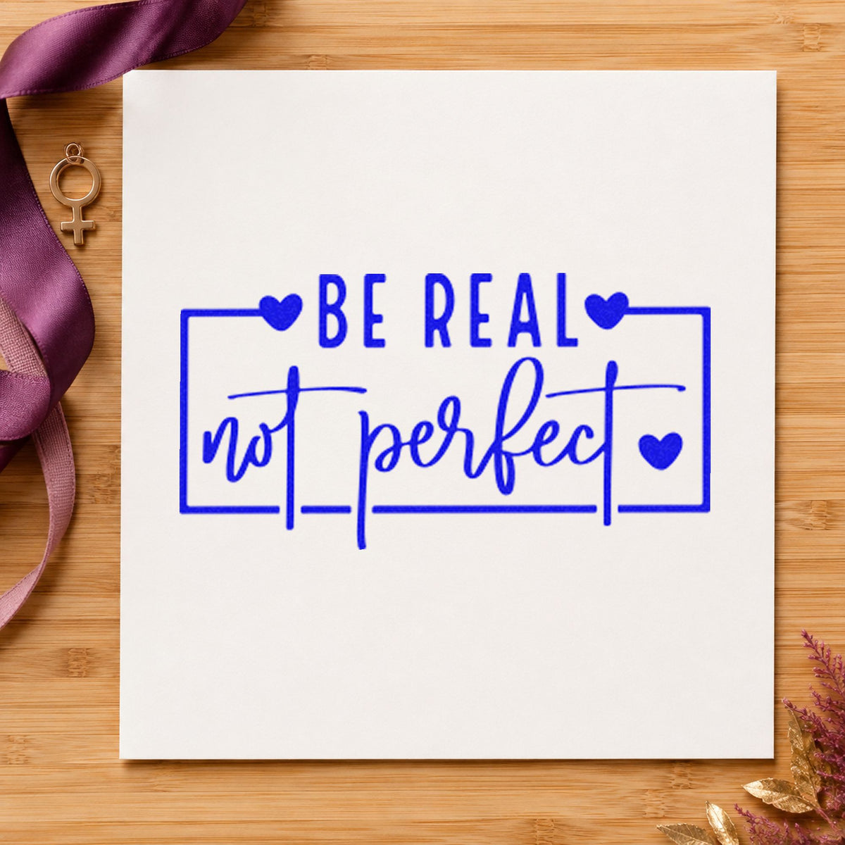Be Real Not Perfect Frame craft stamp imprinted in blue ink on paper, a design suited to framed meeting room.