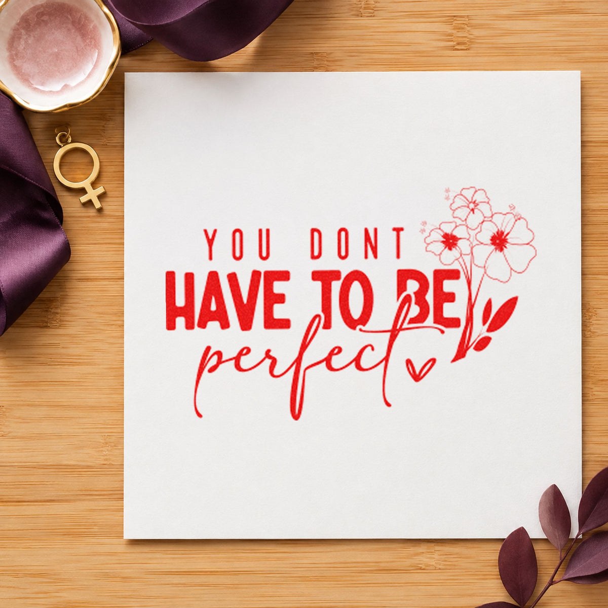 Don't Have To Be Perfect craft stamp imprint in red ink on a handmade project, one idea being grow note cards.