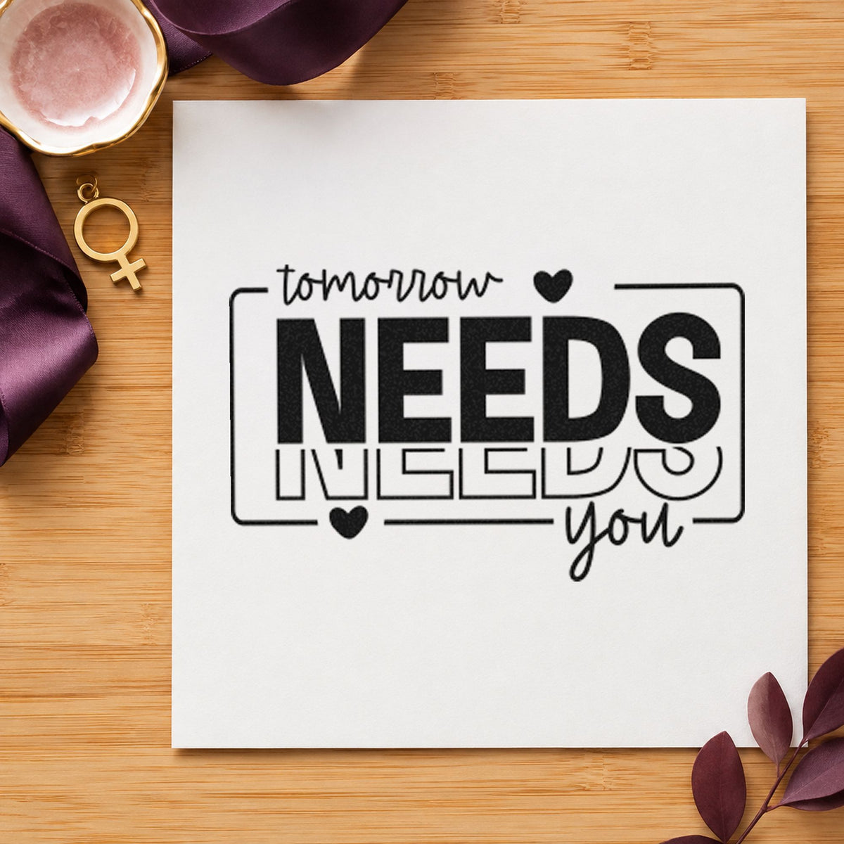 Tomorrow Needs You Repeated craft stamp imprint in black ink on a handmade project, one idea being snack bag gift tags.