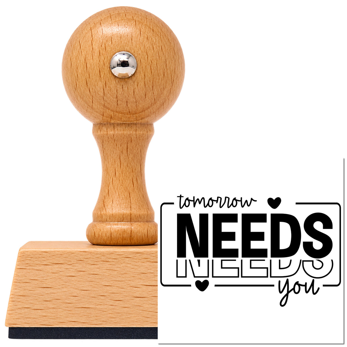 Tomorrow Needs You Repeated Vintage Pro rubber stamp in European beech wood with a round knob handle, shown beside its black imprint.
