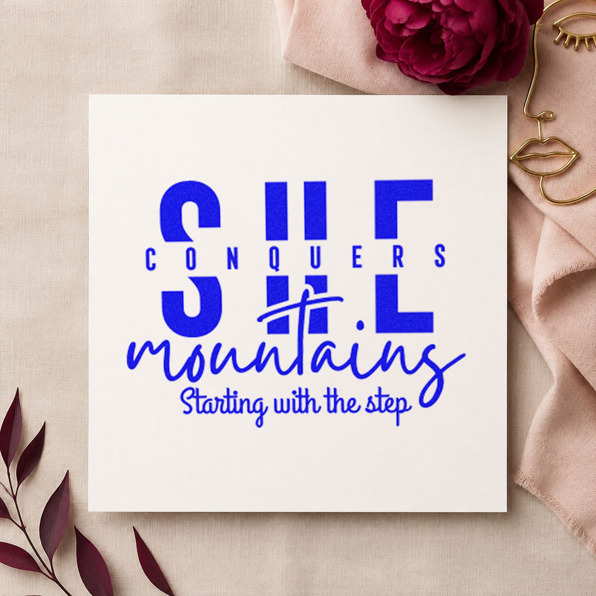 She Conquers Mountains Step craft stamp imprinted in blue ink on paper, a design suited to framed trail board.