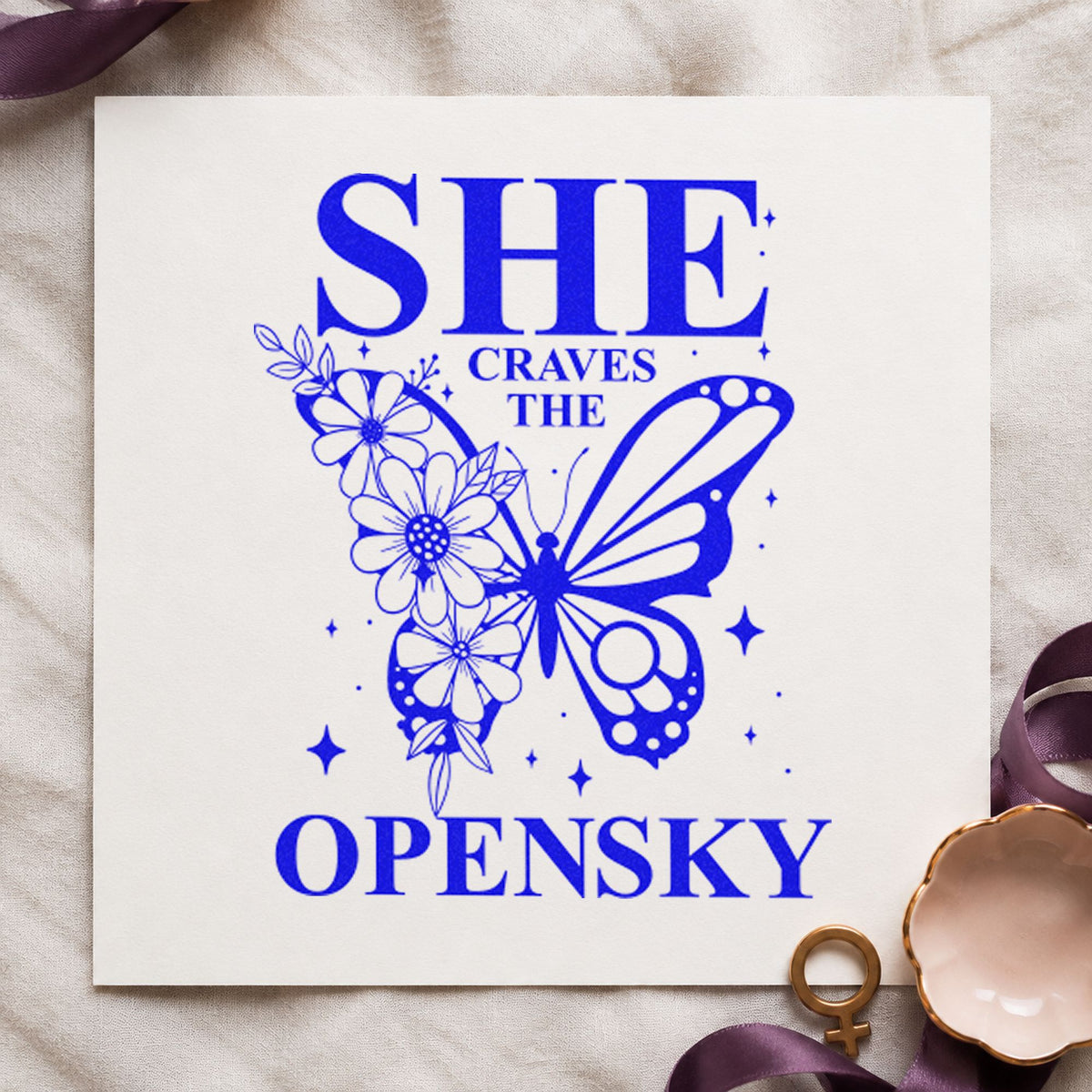She Craves The Open Sky craft stamp imprinted in blue ink on paper, a design suited to framed launch hut.