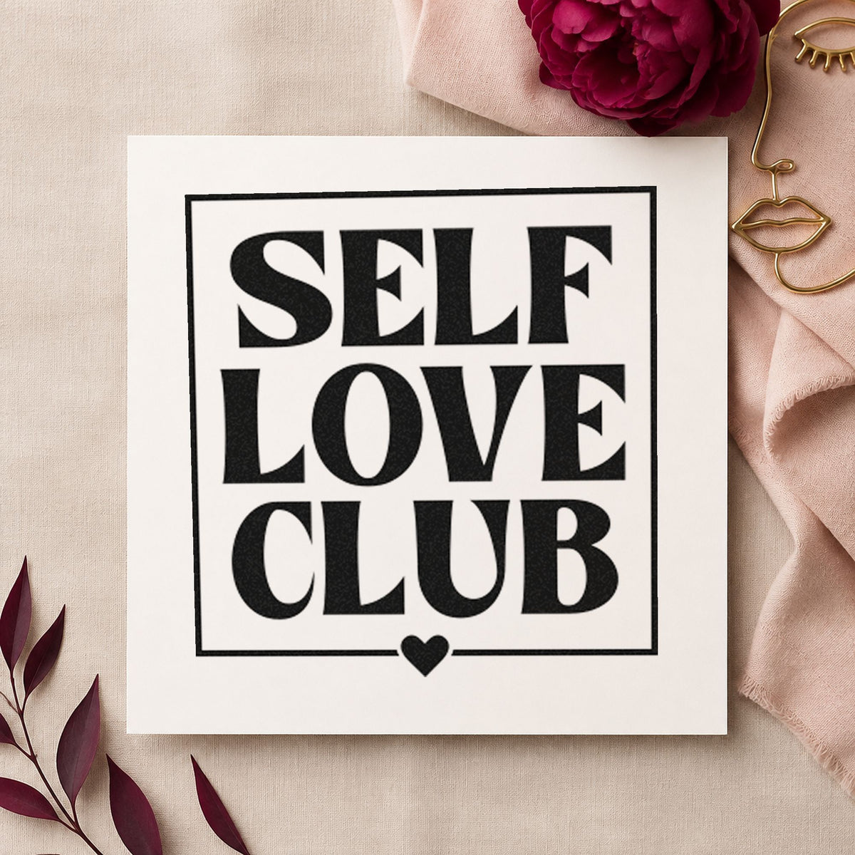 Self Love Club Frame craft stamp imprint in black ink on a handmade project, one idea being grip sock gift tags.