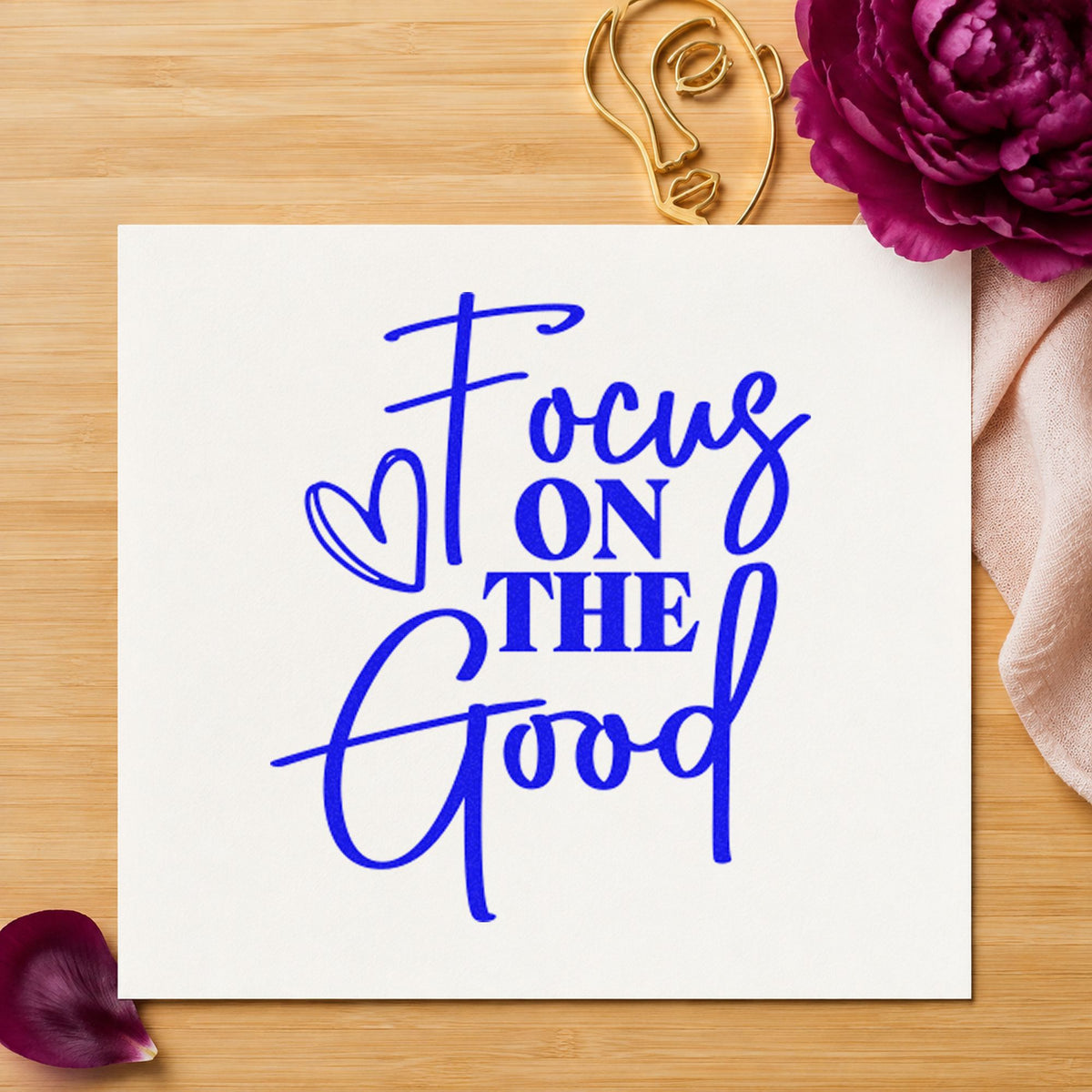 Focus On The Good craft stamp in blue ink on cardstock, an easy option for chair throw printing.