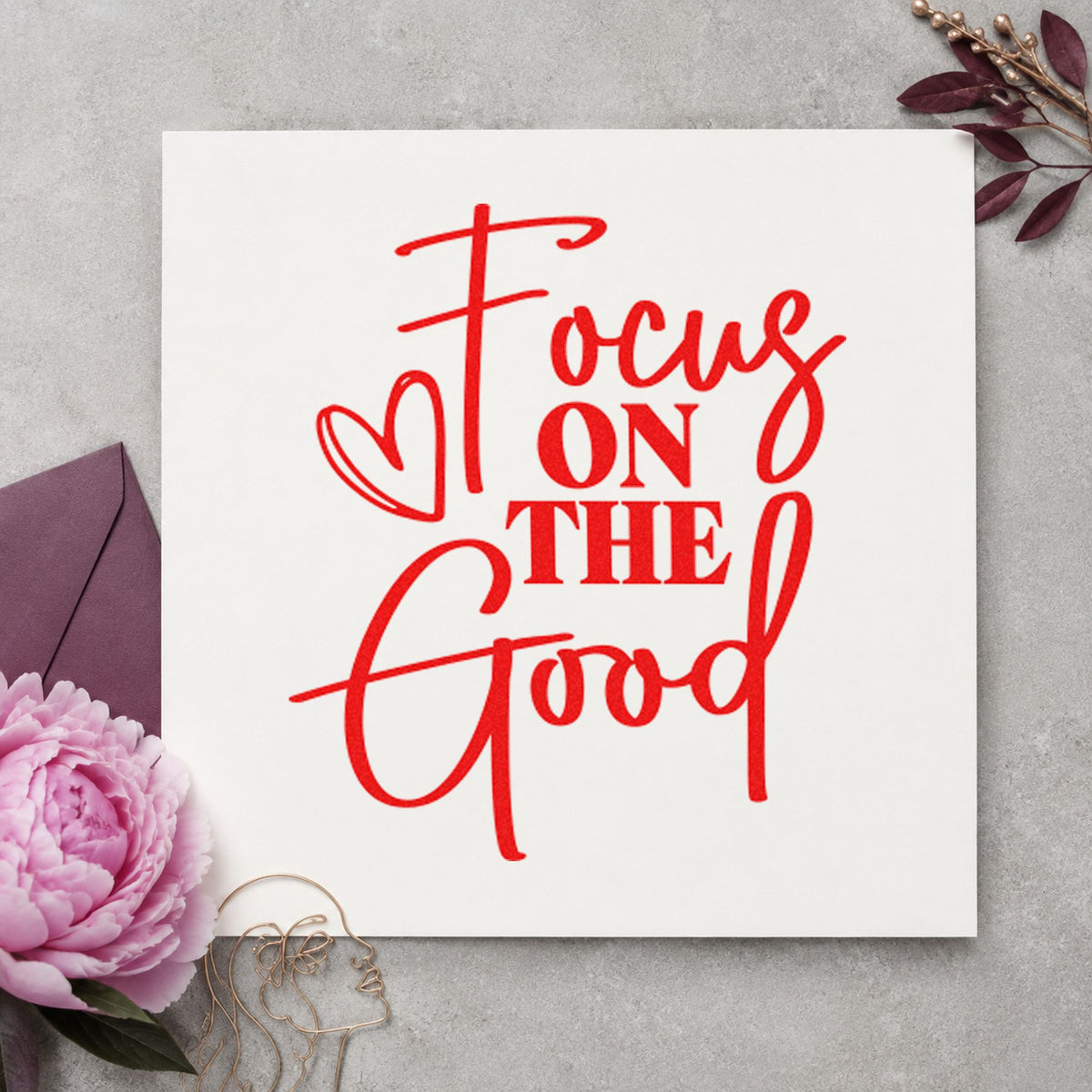 Focus On The Good rubber stamp shown in red ink, stamped for projects such as shelf volume labels.