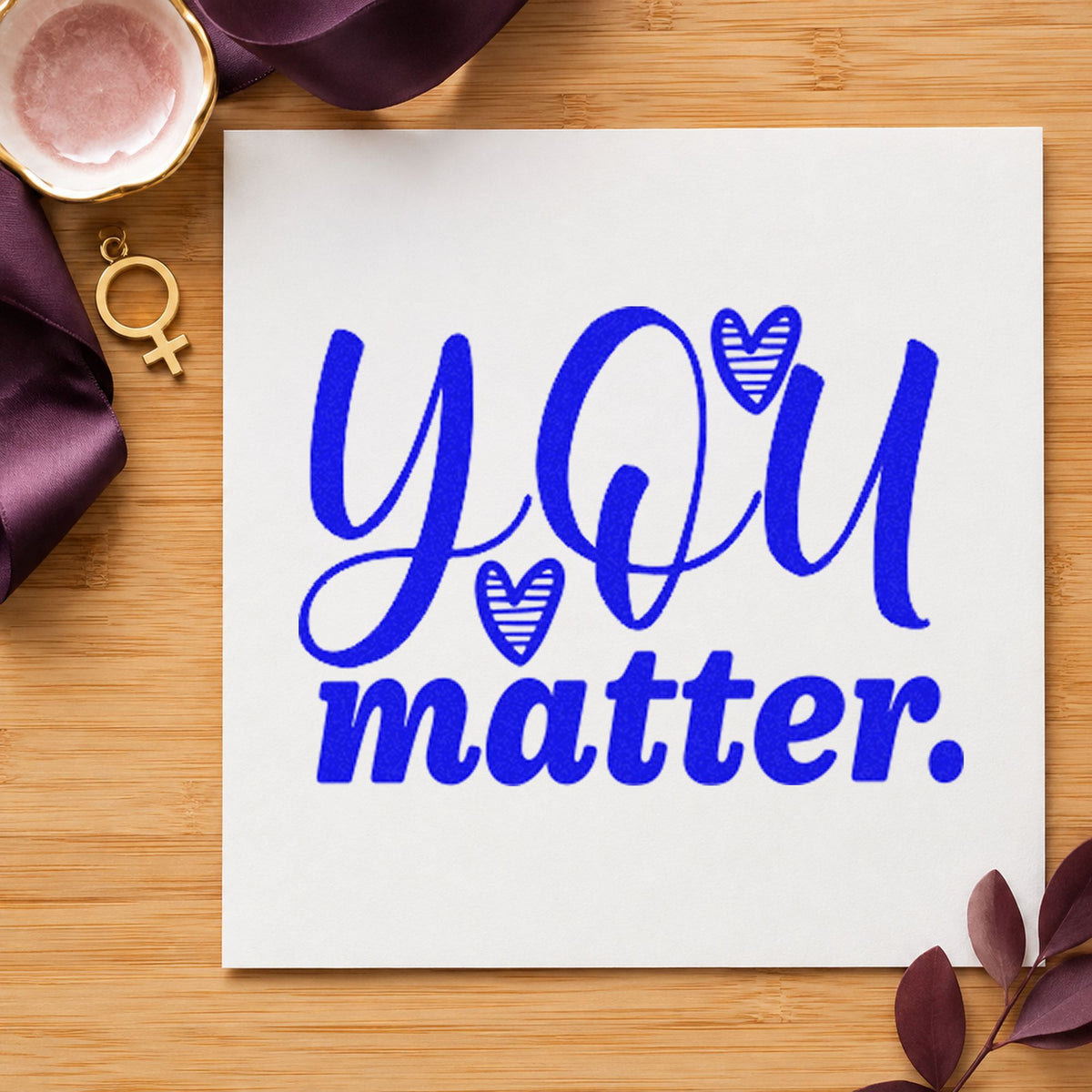 You Matter Striped Hearts craft stamp in blue ink on cardstock, an easy option for group hoodie printing.