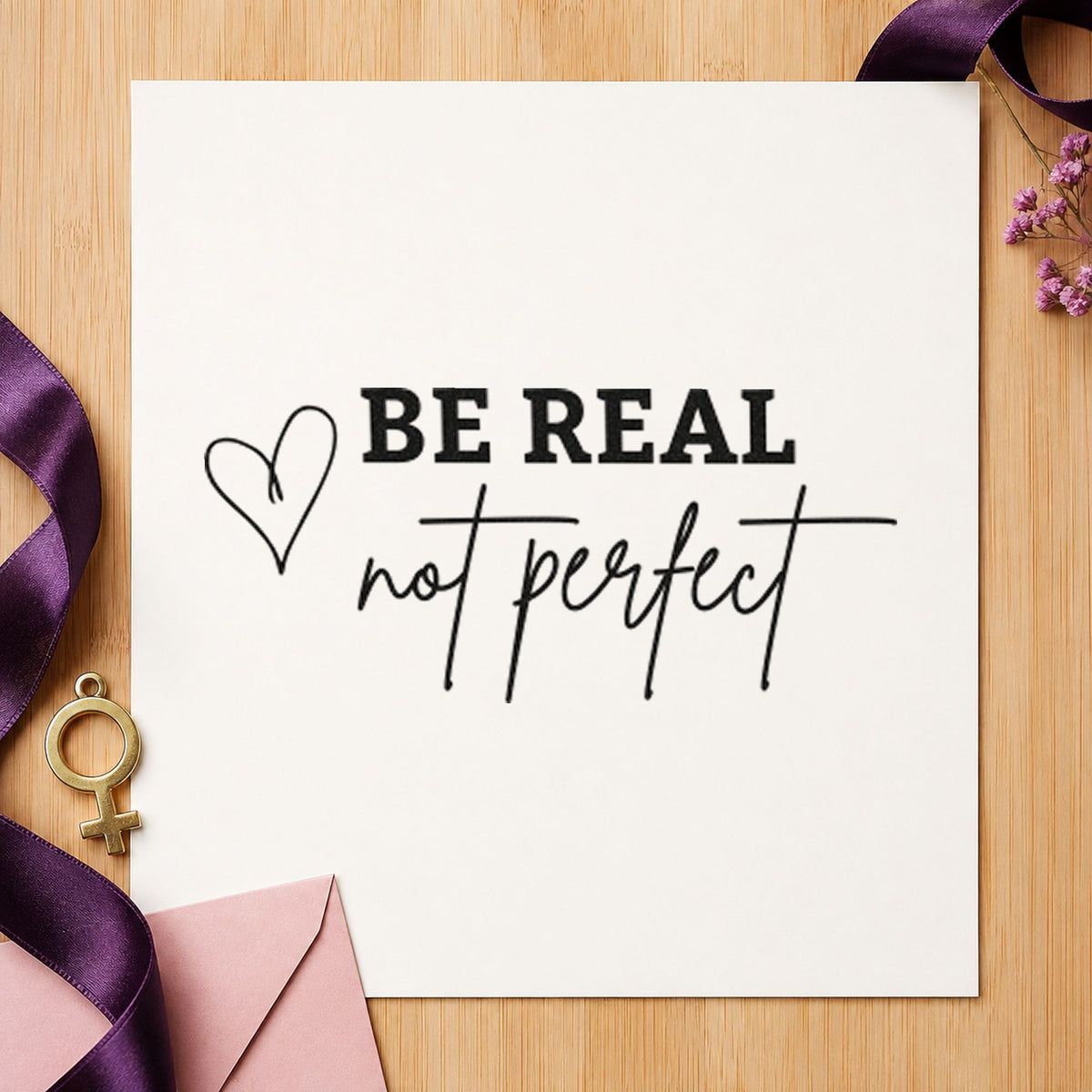 Be Real Not Perfect craft stamp imprint in black ink on a handmade project, one idea being print pack gift tags.