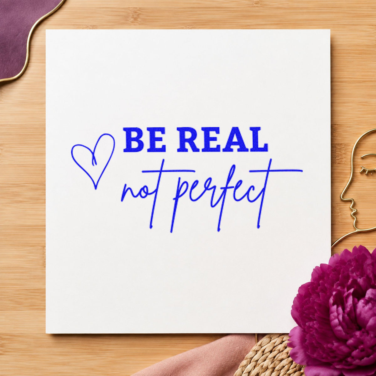 Be Real Not Perfect craft stamp in blue ink on cardstock, an easy option for backdrop cloth printing.