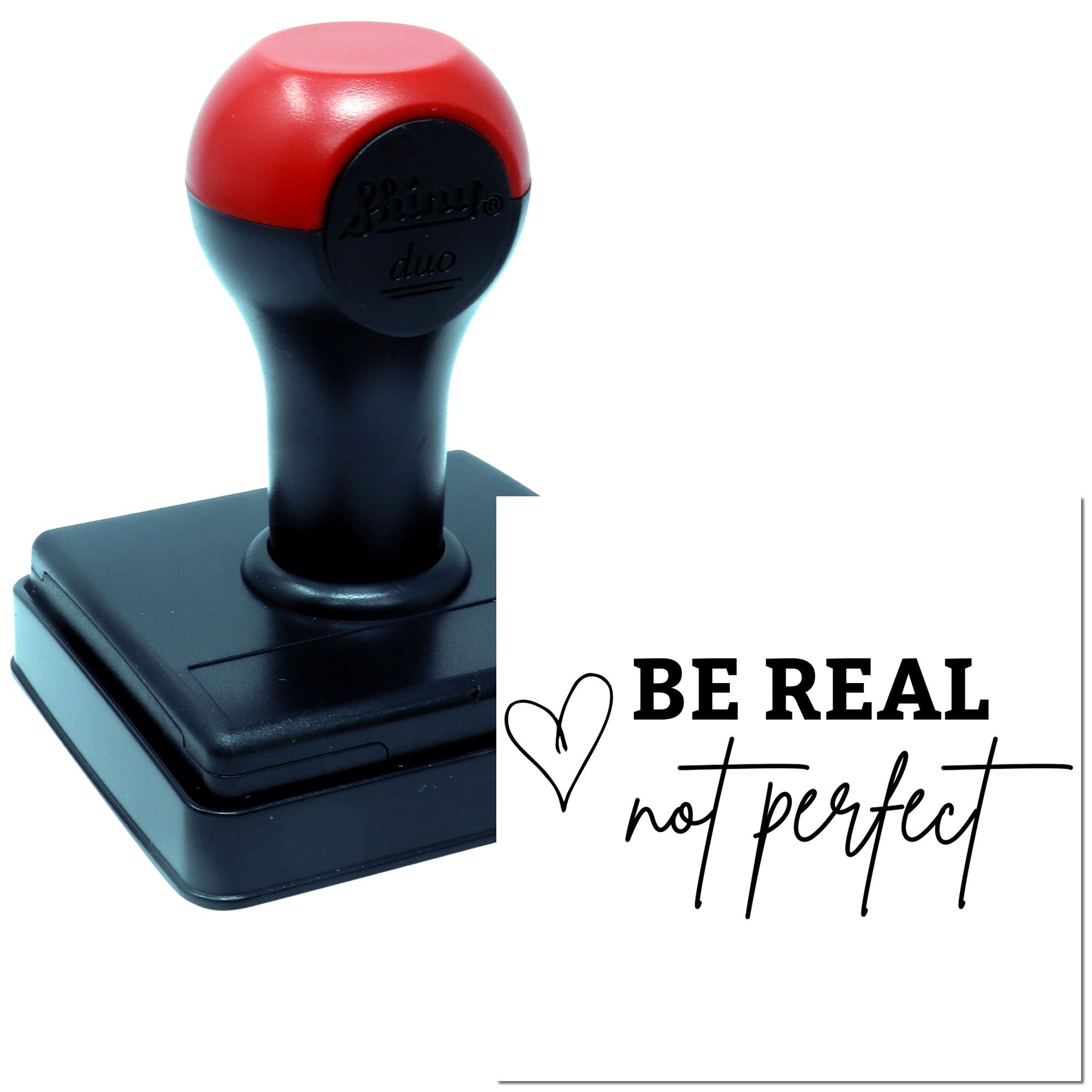 Self-inking rubber stamp with "Be real not perfect" design for inspirational crafting and personalized stamping.