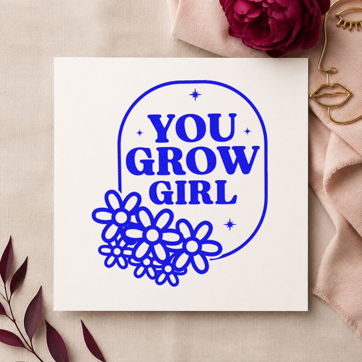 You Grow Girl Flowers craft stamp in blue ink on cardstock, an easy option for stall apron printing.