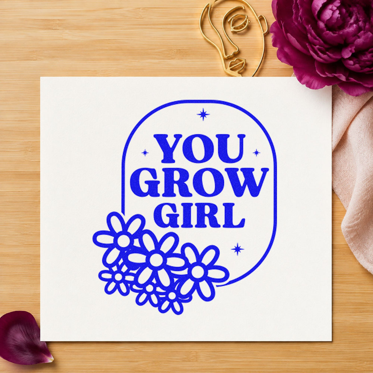 You Grow Girl Flowers craft stamp imprinted in blue ink on paper, a design suited to framed school greenhouse.