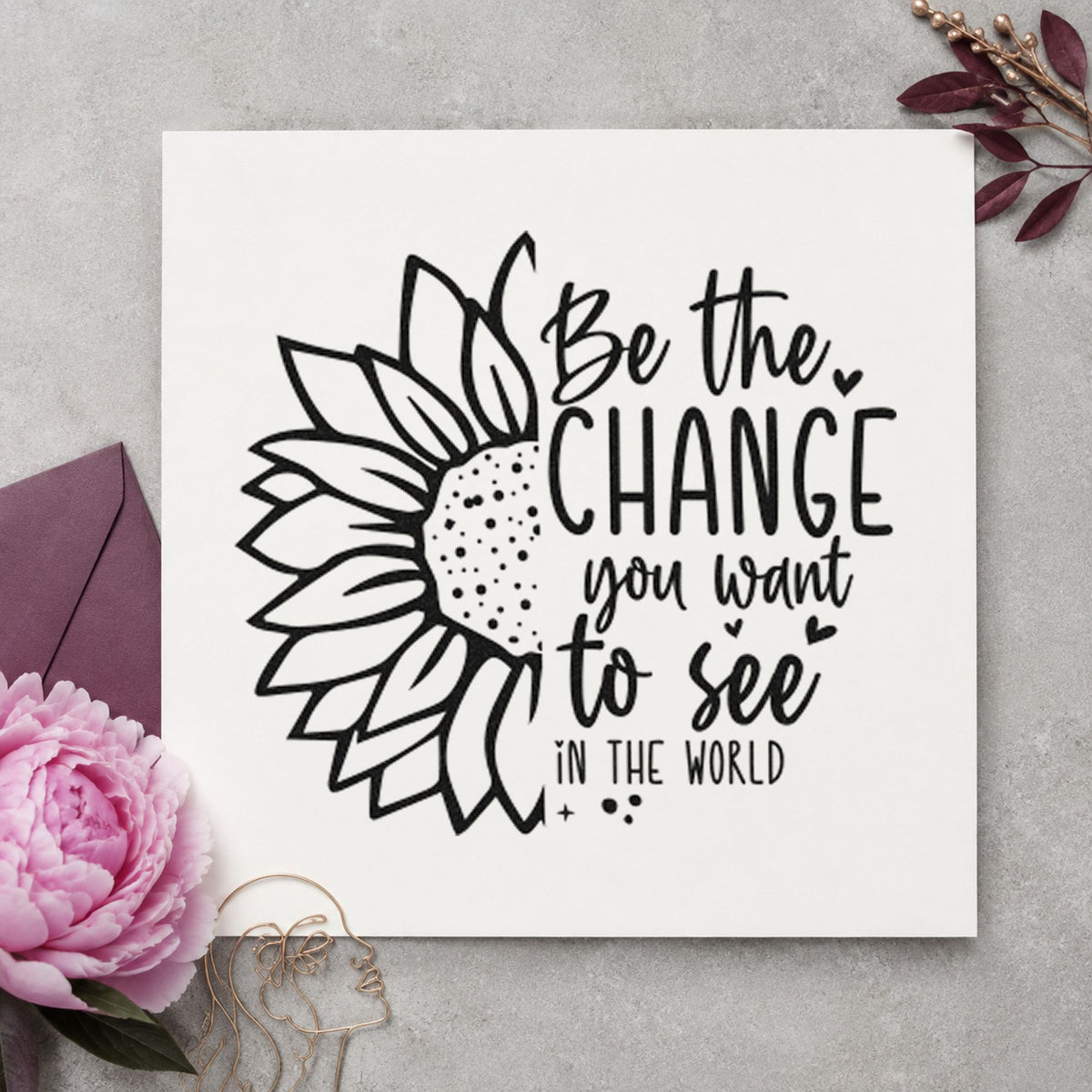 Be The Change Sunflower craft stamp imprint in black ink on a handmade project, one idea being collection bin tags.