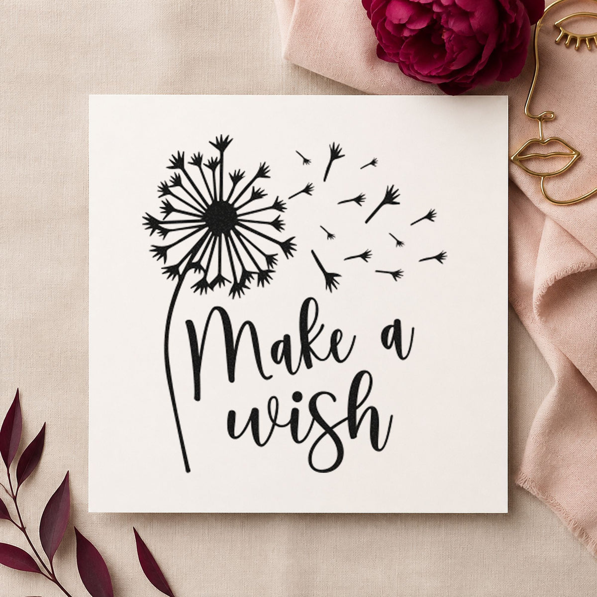 Make A Wish Dandelion craft stamp imprint in black ink on a handmade project, one idea being adventure gift tags.