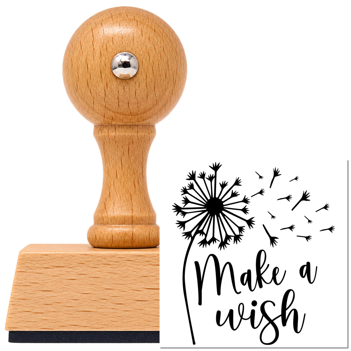 Make A Wish Dandelion Vintage Pro rubber stamp in European beech wood with a round knob handle, shown beside its black imprint.