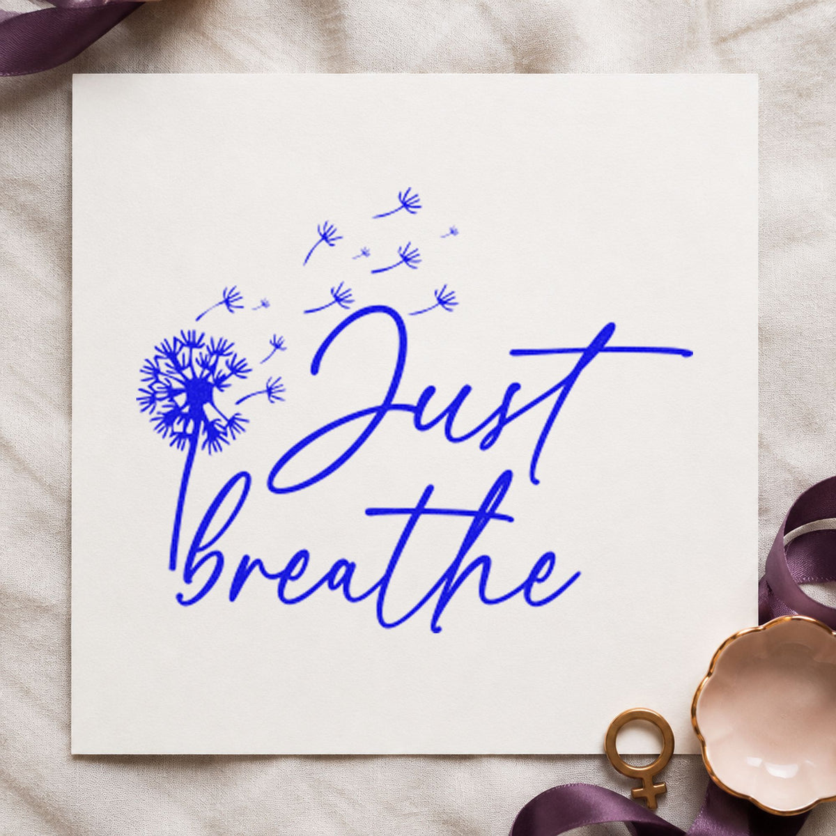 Just Breathe Dandelion Seeds craft stamp imprinted in blue ink on paper, a design suited to framed gear room.