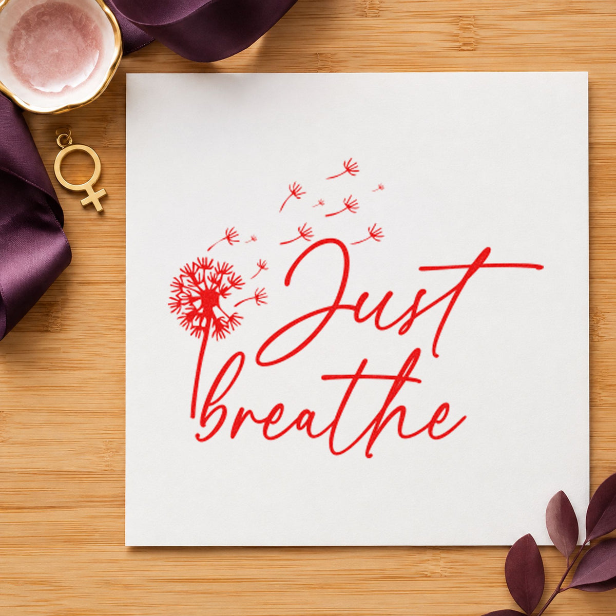 Just Breathe Dandelion Seeds rubber stamp shown in red ink, stamped for projects such as bin weight labels.
