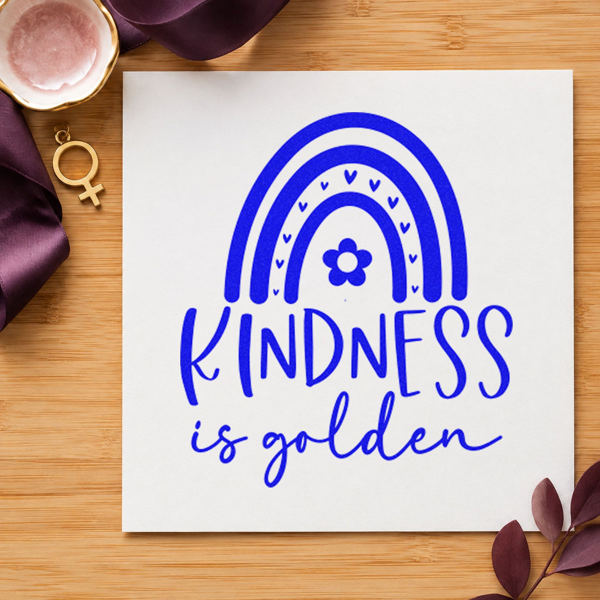 Kindness Is Golden Rainbow craft stamp in blue ink on cardstock, an easy option for cutting cape printing.