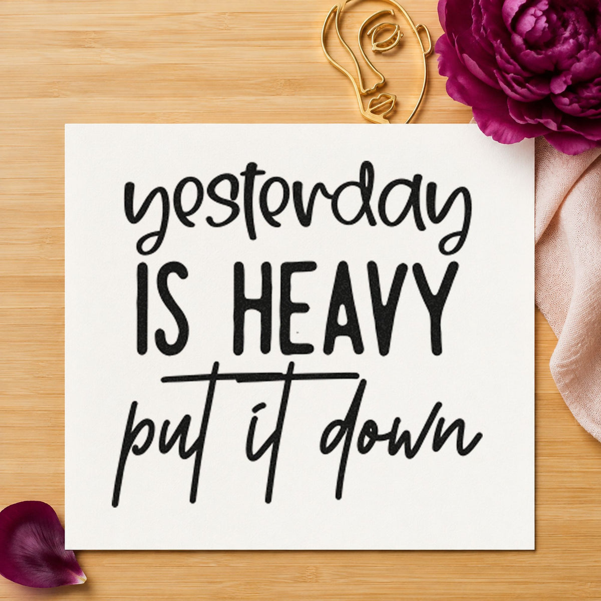 Yesterday Is Heavy Quote craft stamp imprint in black ink on a handmade project, one idea being kit bag gift tags.