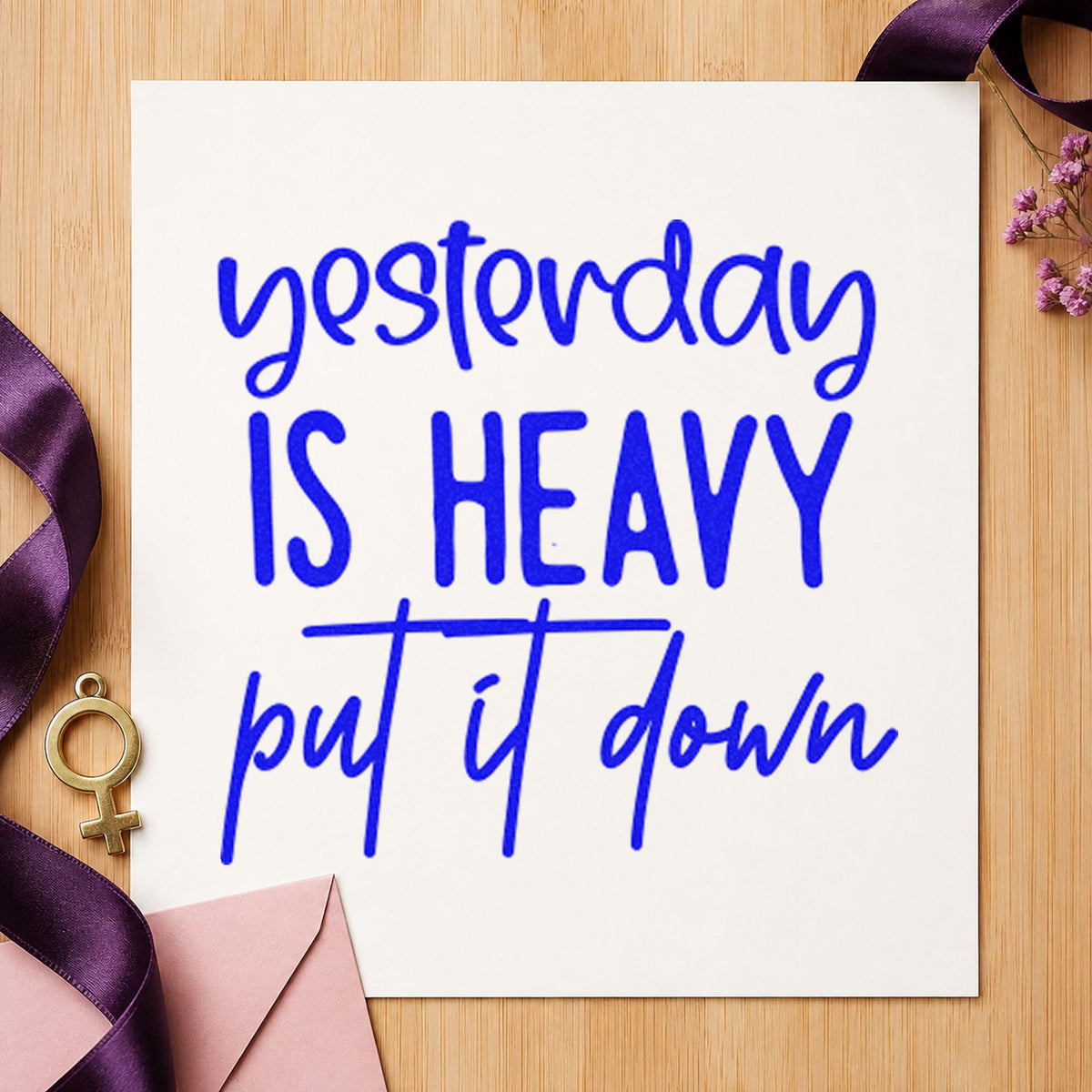 Yesterday Is Heavy Quote craft stamp imprinted in blue ink on paper, a design suited to framed team room.