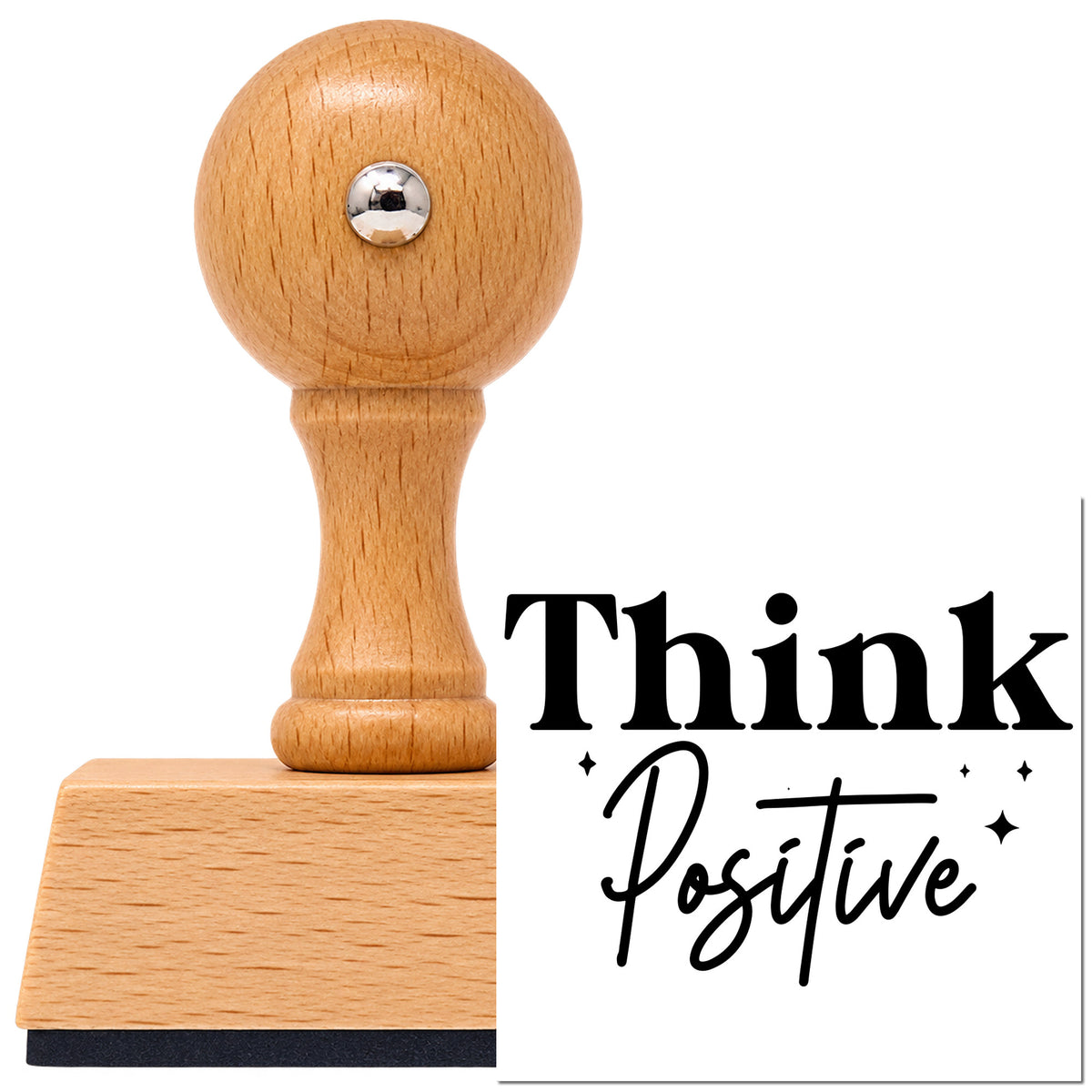 Think Positive Sparkle Word Art Vintage Pro rubber stamp in European beech wood with a round knob handle, shown beside its black imprint.