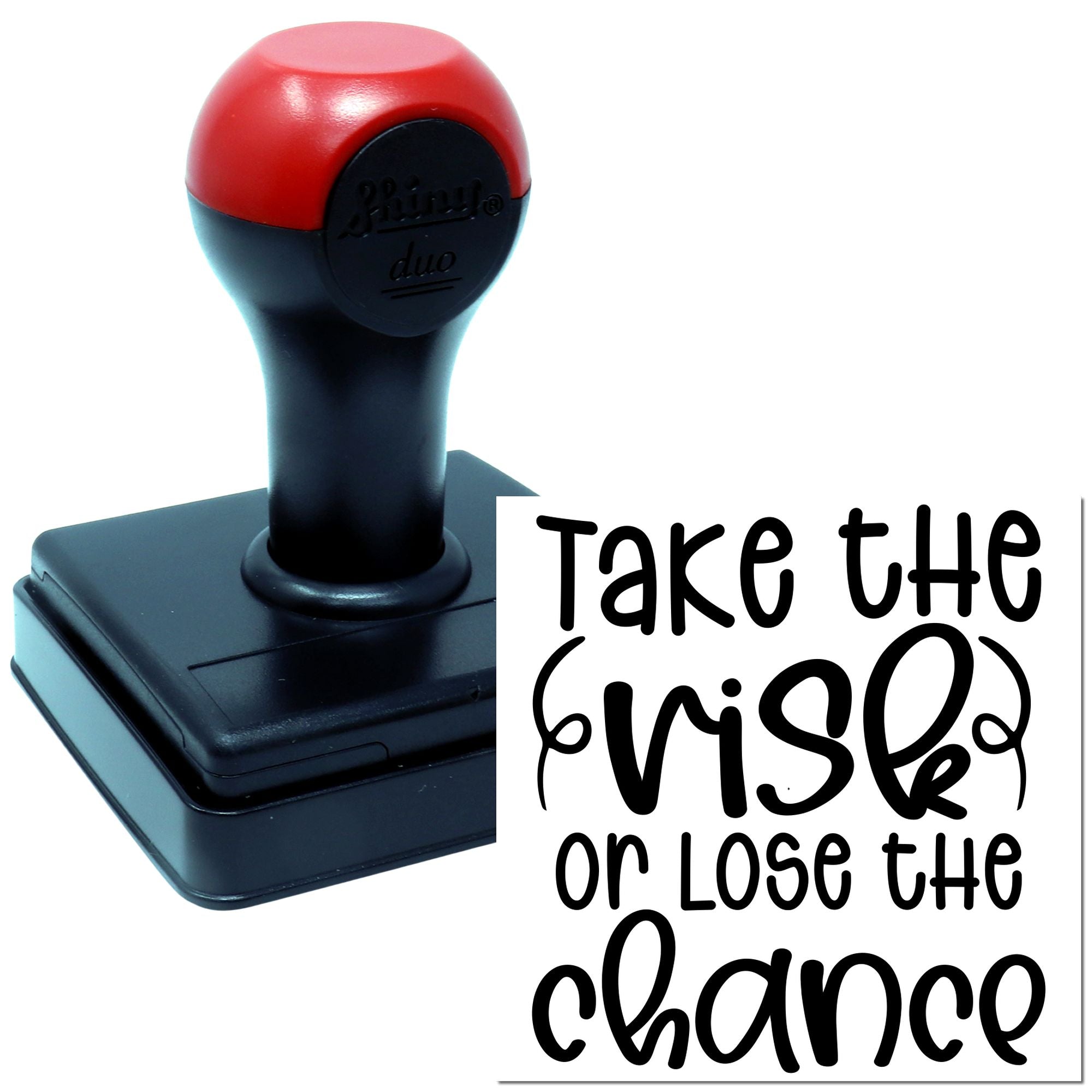 Self-inking rubber stamp displaying the quote Take the risk or lose the chance for motivational marking.