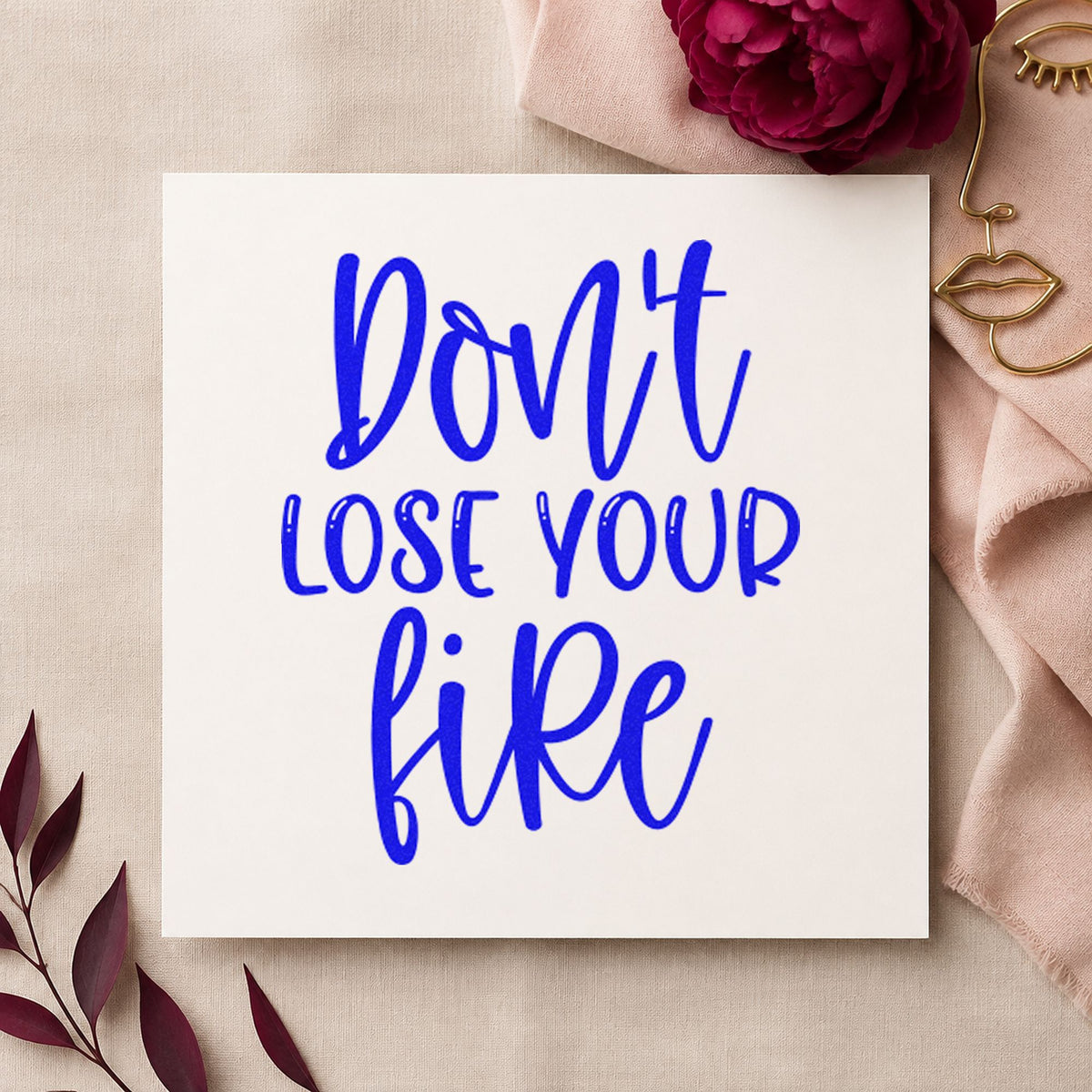 Do Not Lose Fire craft stamp in blue ink on cardstock, an easy option for pit apron printing.
