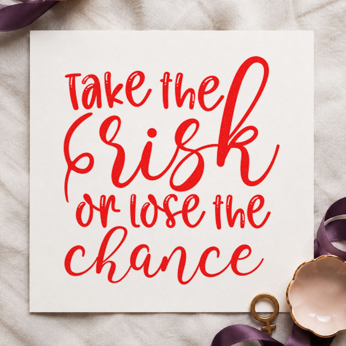 Take Risk Lose Chance craft stamp imprint in red ink on a handmade project, one idea being seat place cards.