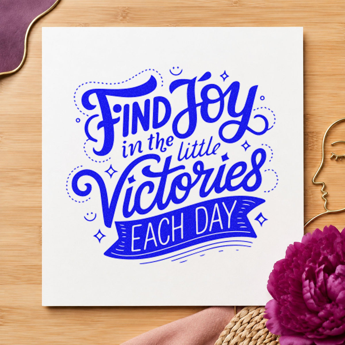 Find Joy Little Victories craft stamp imprinted in blue ink on paper, a design suited to framed class room.