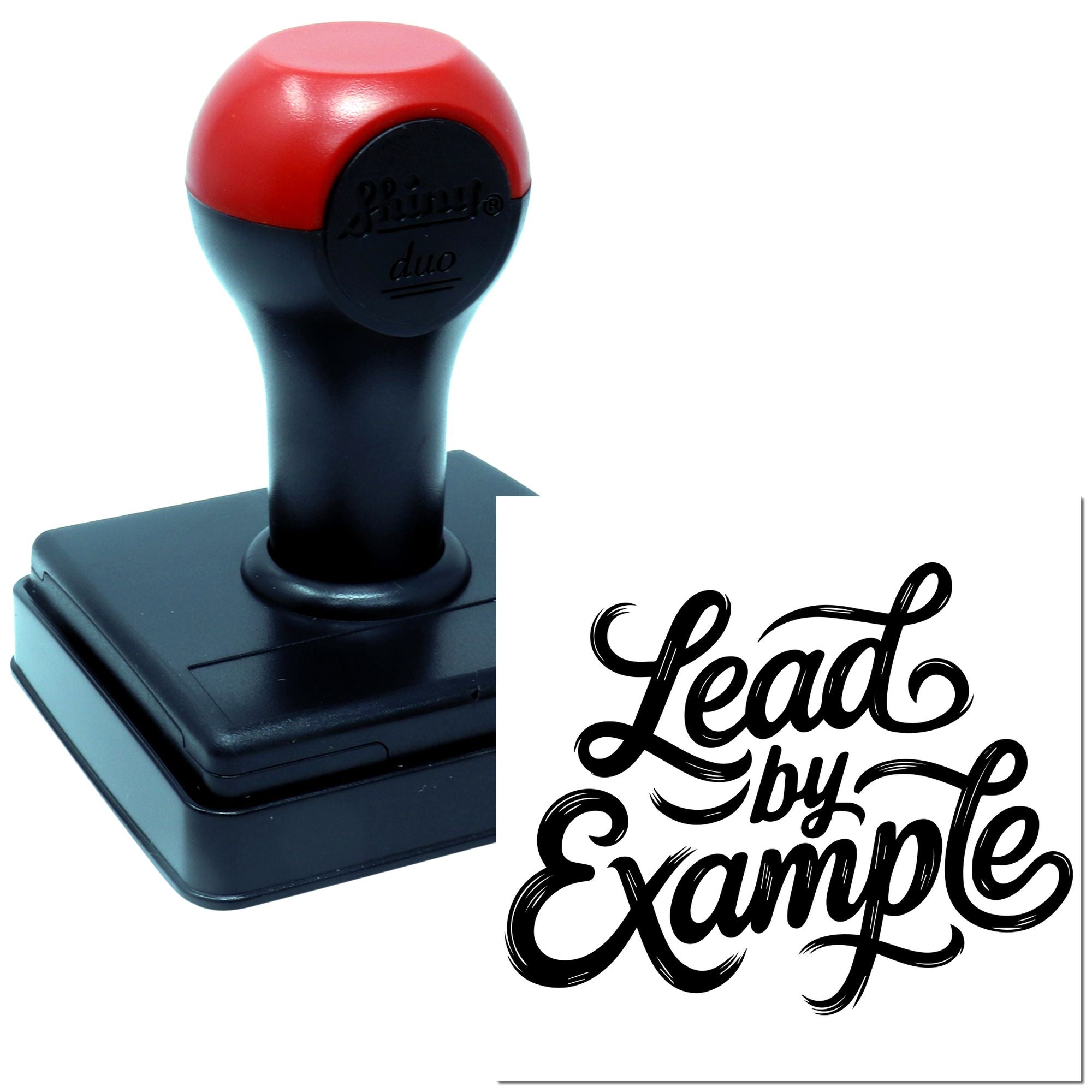 Custom self-inking rubber stamp showing Lead by Example script imprint for branding, crafting, or office use.