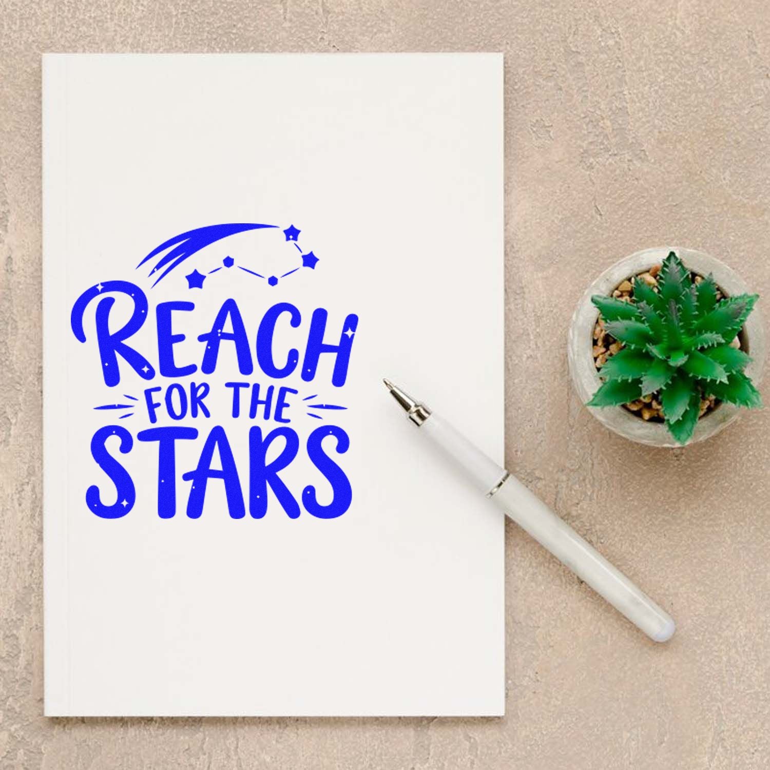 Reach for the Stars motivational rubber stamp design on notebook, perfect for journaling, crafts, and teacher gifts.