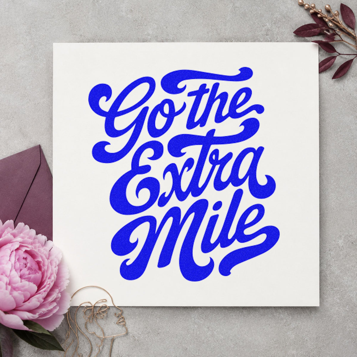 Go The Extra Mile craft stamp imprinted in blue ink on paper, a design suited to framed depot corner.